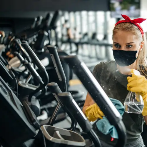 Professional gym cleaning services in a commercial fitness facility
