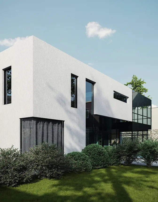 A modern white house surrounded by a spacious green lawn under a clear blue sky