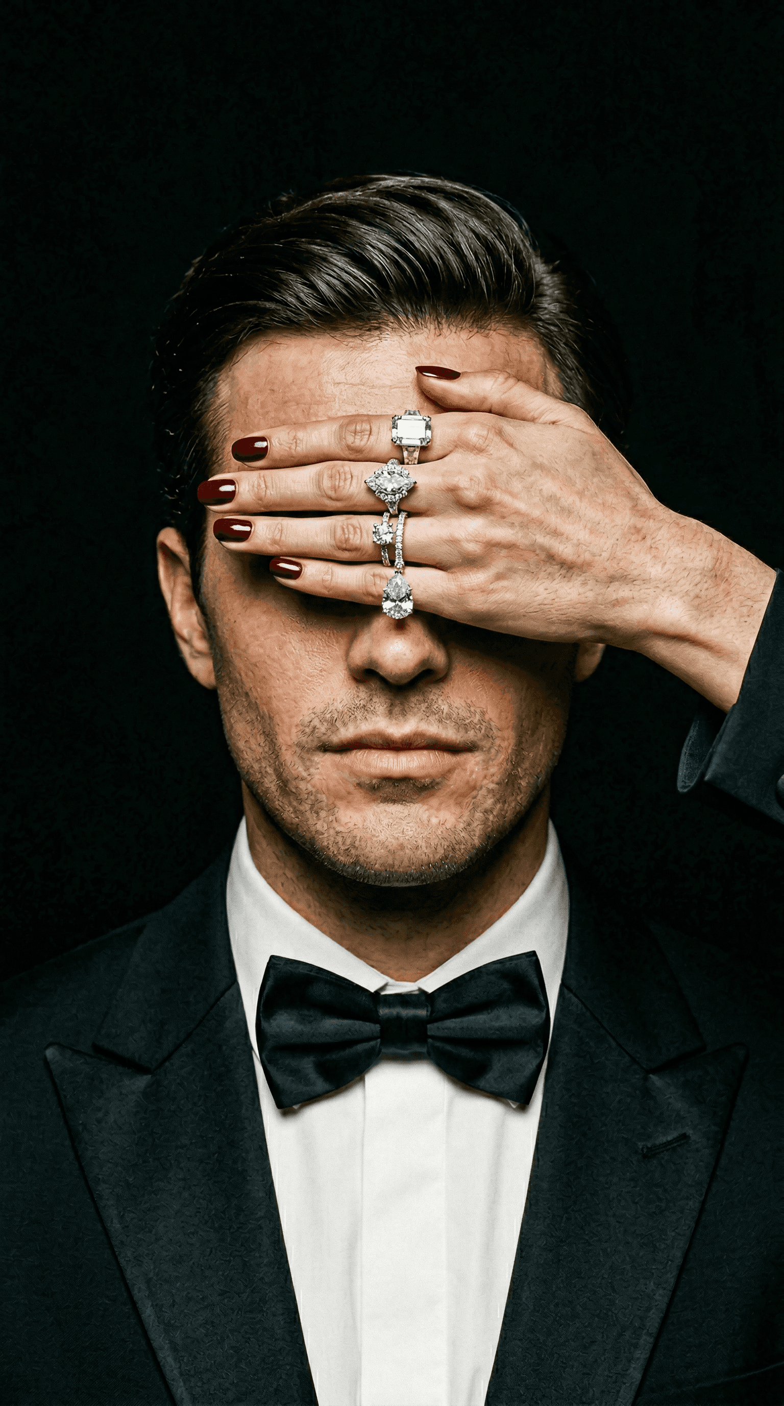 Pearl drop earring and layered gold chains in soft focus fashion portrait