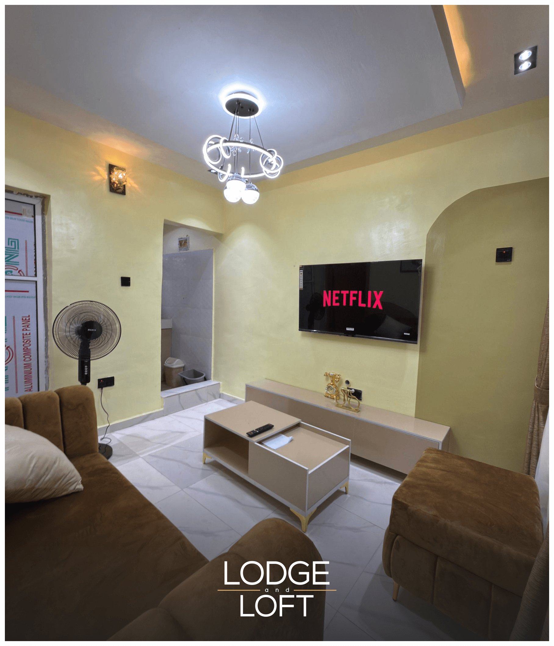 Modern living room with TV at Havana Isimi Apartment, serviced apartment in Gbagada, Lagos