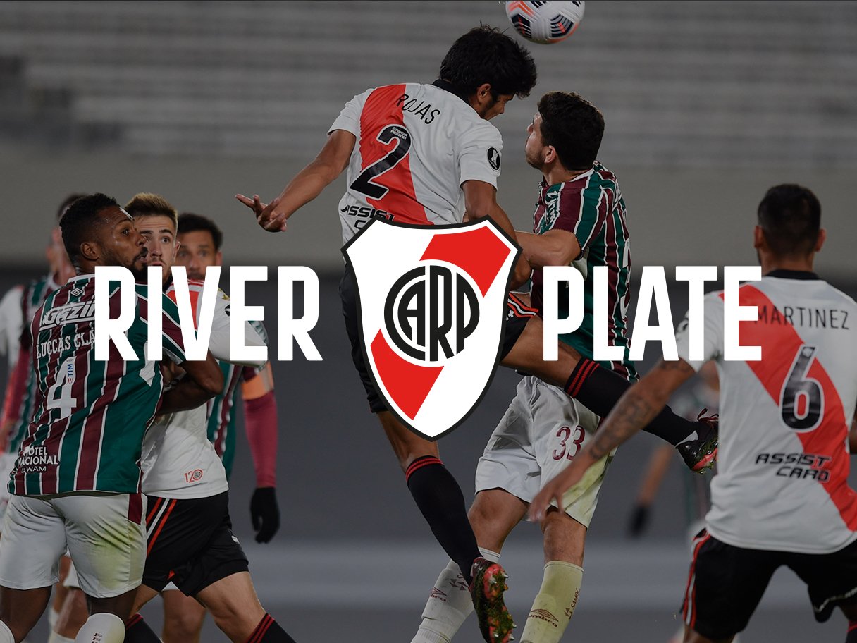 Rooftops of a coastal town with the sea in background