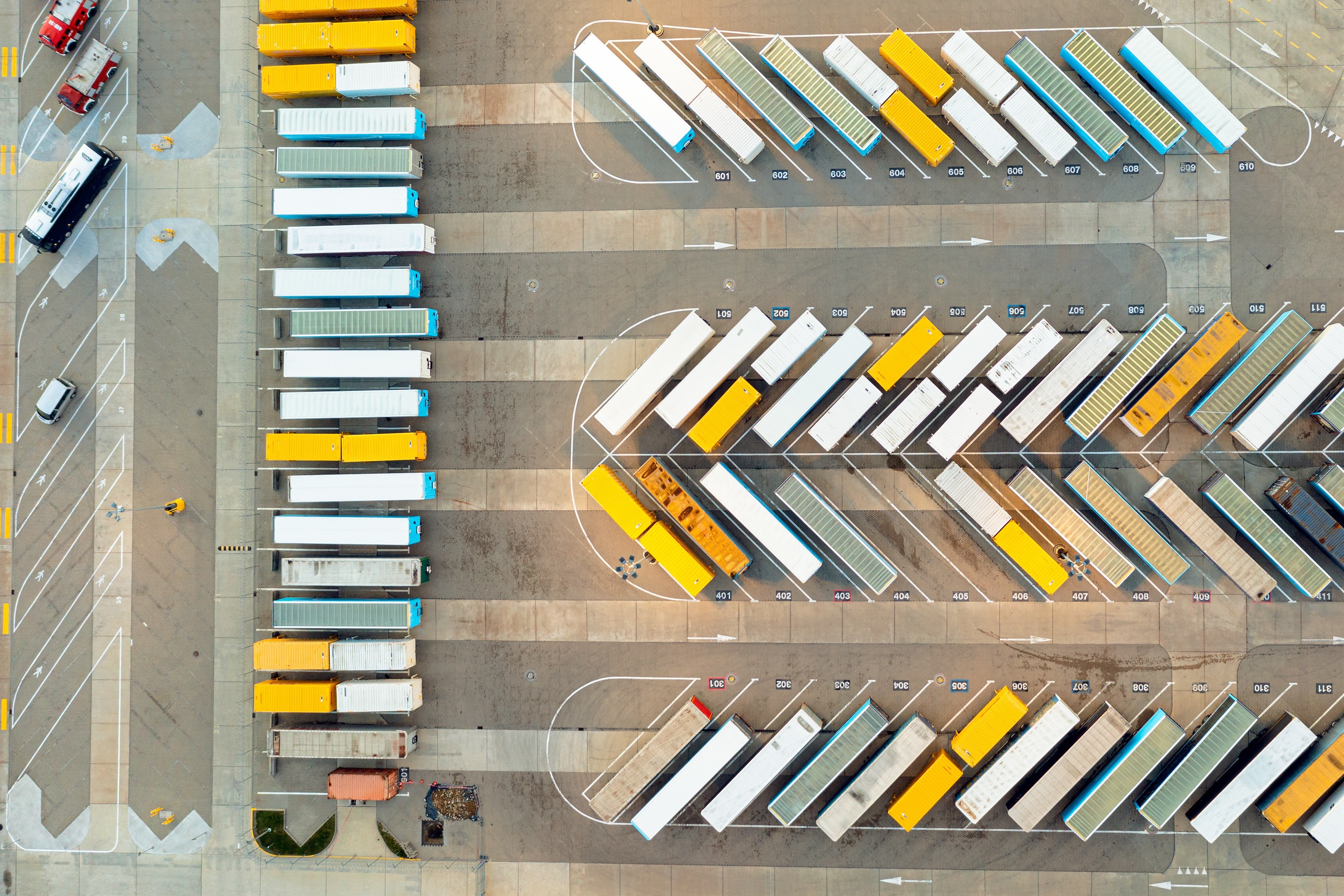 An aerial view of trailers in a warehouse yard.