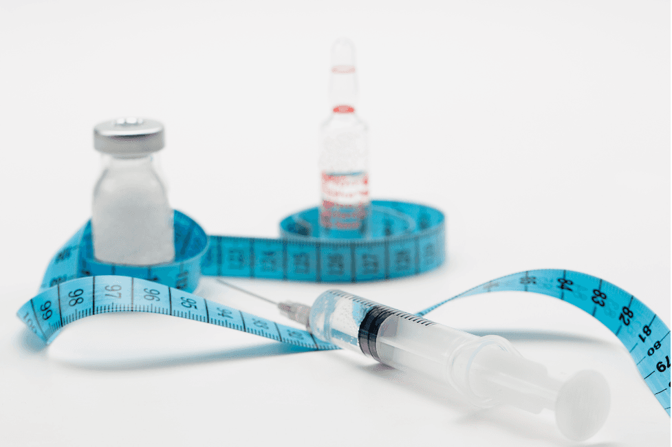 Image showing a vial, syringe and a measuring tape