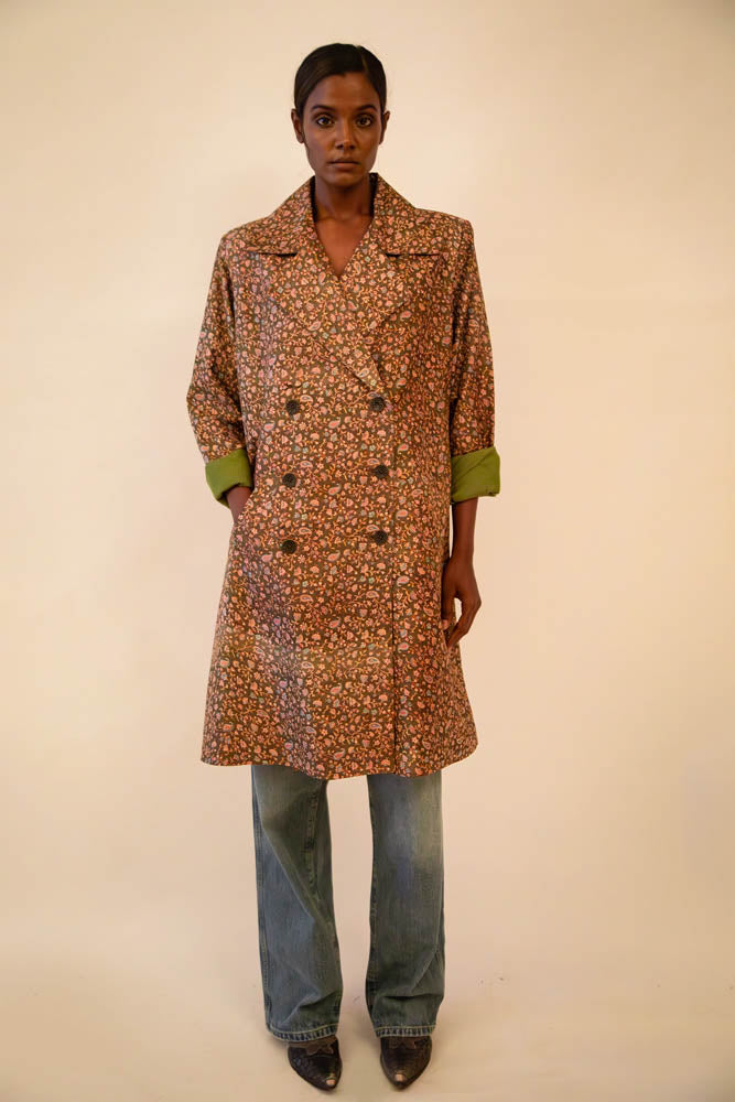 Ved is our one-of-a-kind paisley olive green silk trench coat, handcrafted by skilled artisans in-house using a vintage silk sari