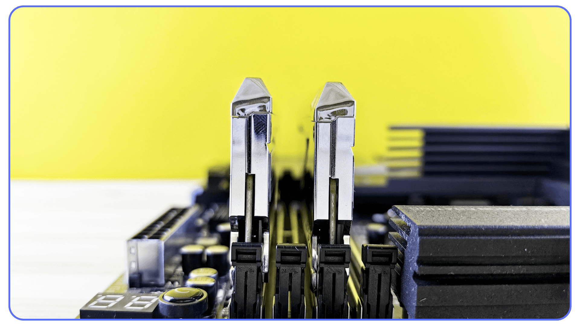 Two RAM modules installed on a motherboard with a yellow background, symbolizing the role of memory in maintaining AutoCAD speed and stability.