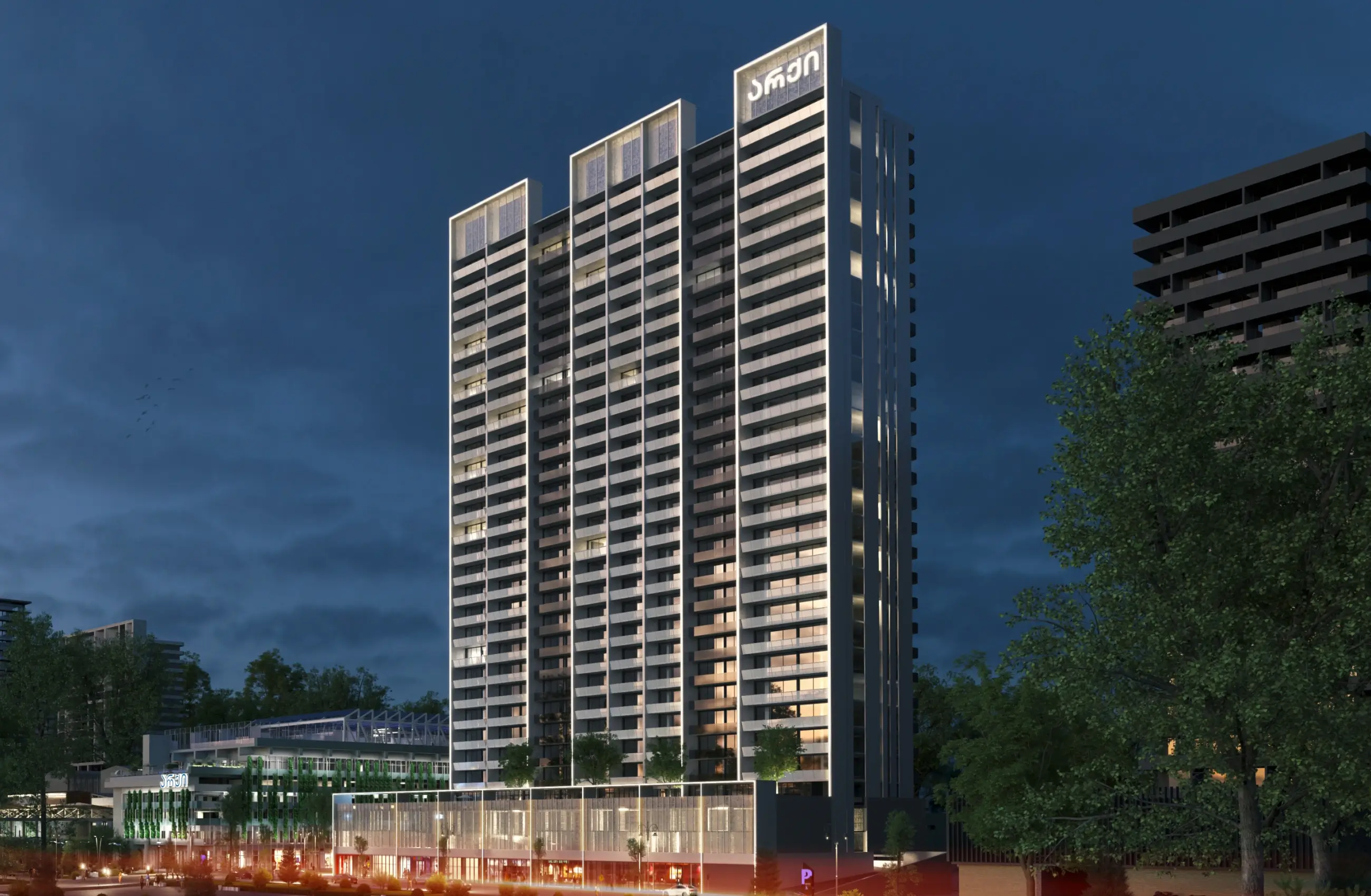 green glass high-rise buildings near road