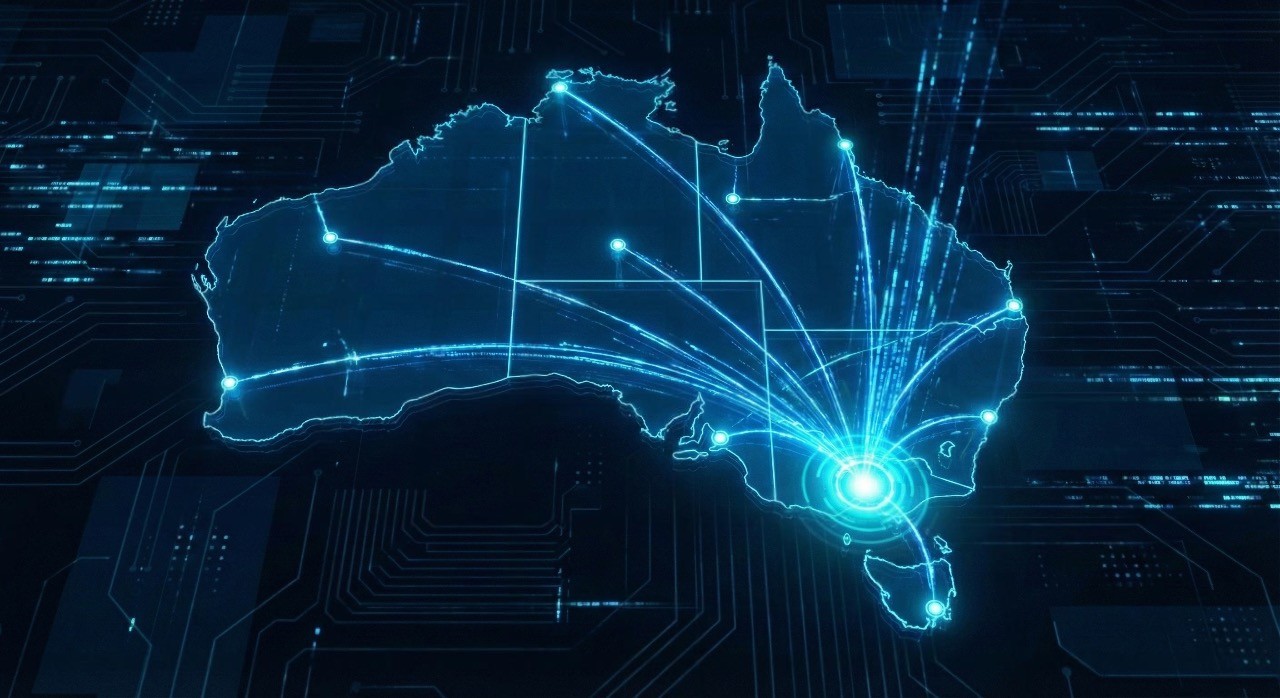 A glowing digital network map of Australia, representing the interconnected Australian FM software landscape, with data lines radiating from a central hub in Melbourne to represent nationwide facility management software coverage.