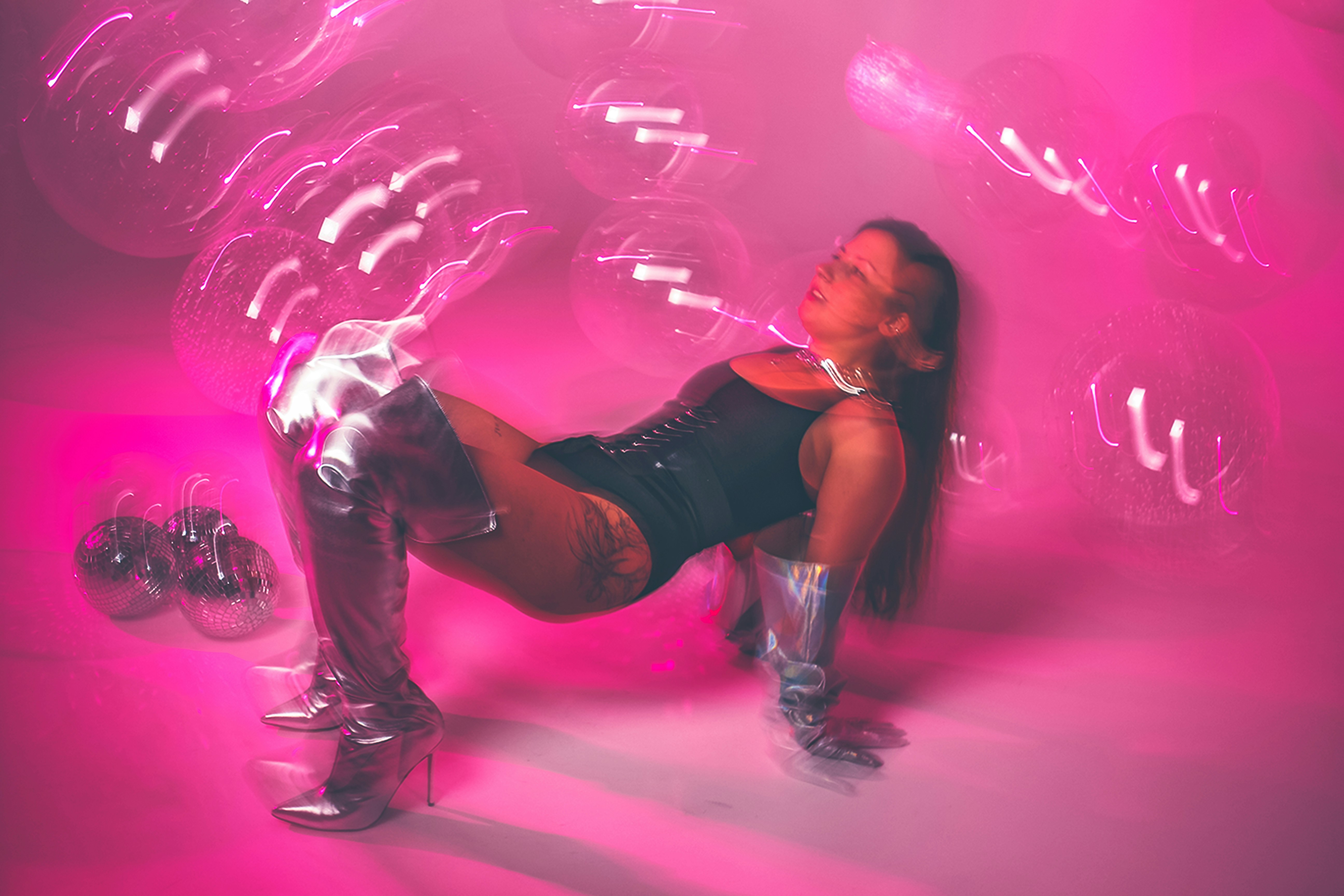 Woman floating in vibrant pink liquid, surreal and artistic visual from Pharmapro creative direction by Softic Studio