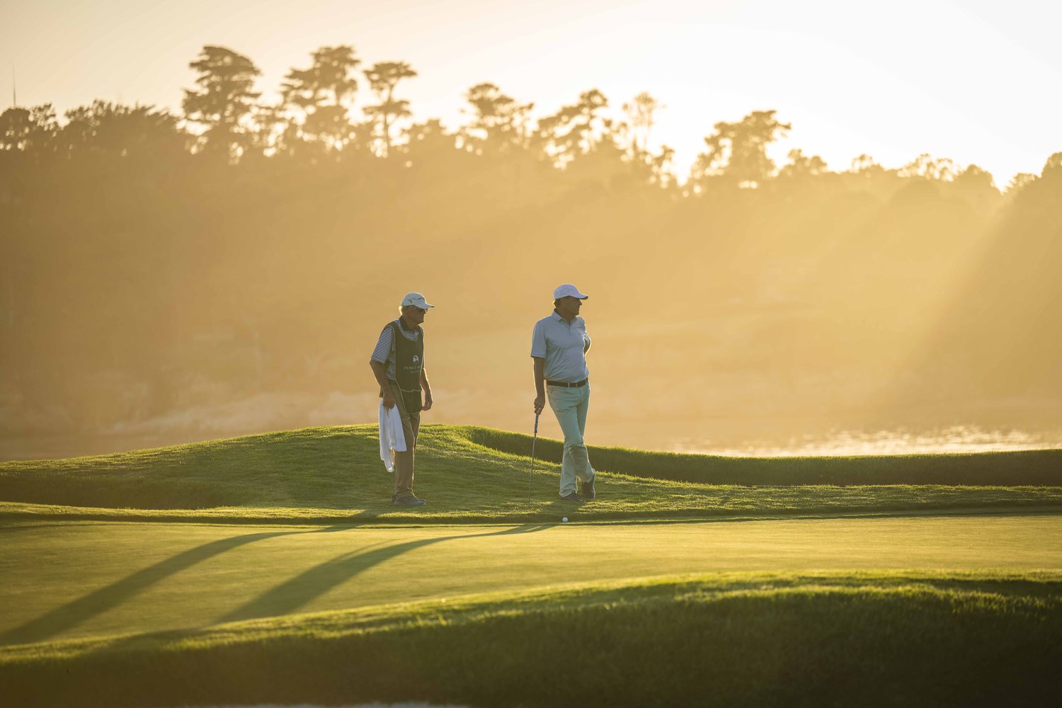 Golfers at sunset