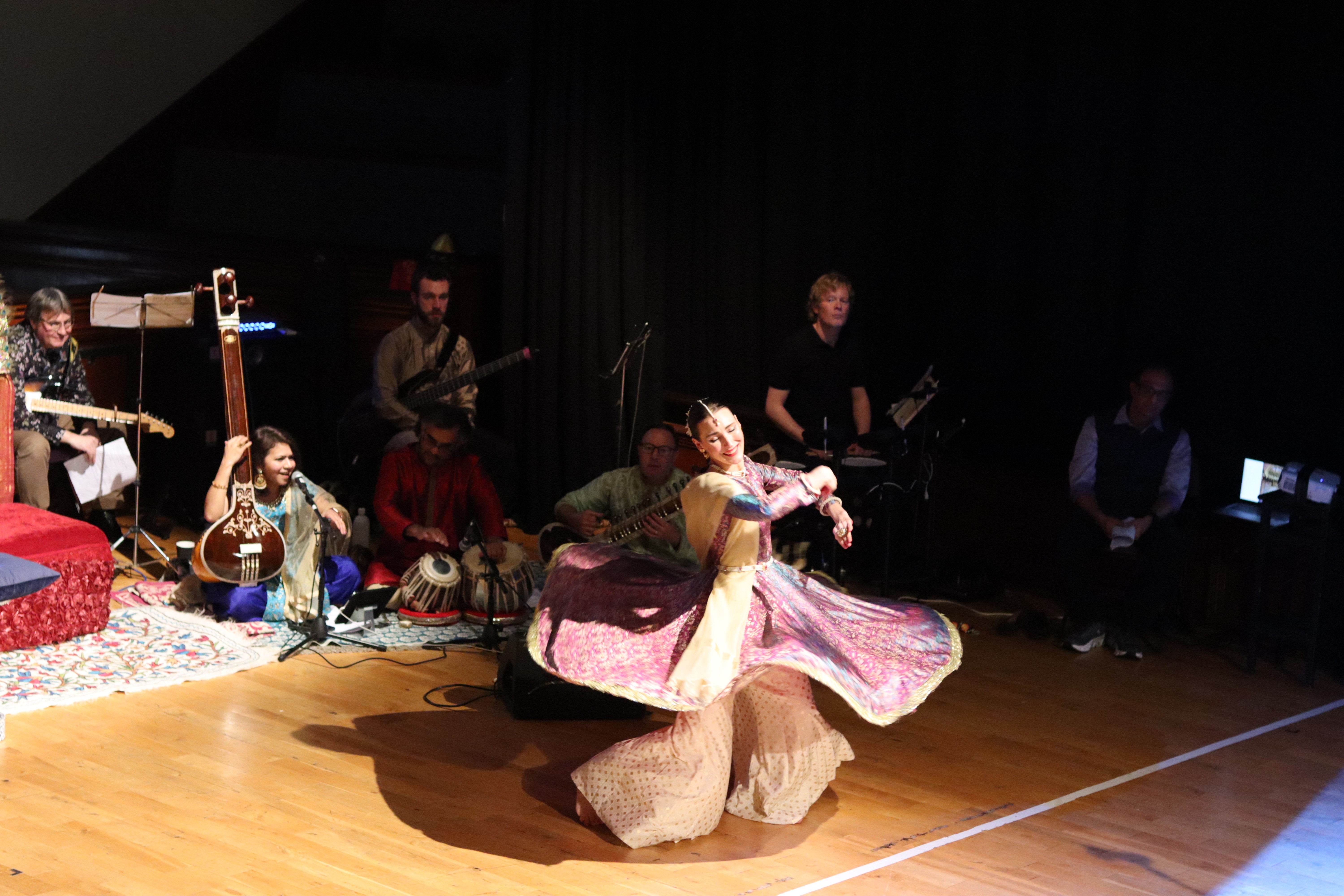 A person stands in a sandstone cave.