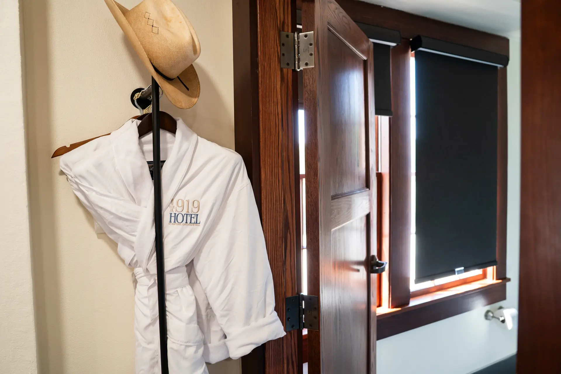 Robe, cowboy hat and bathroom entrance