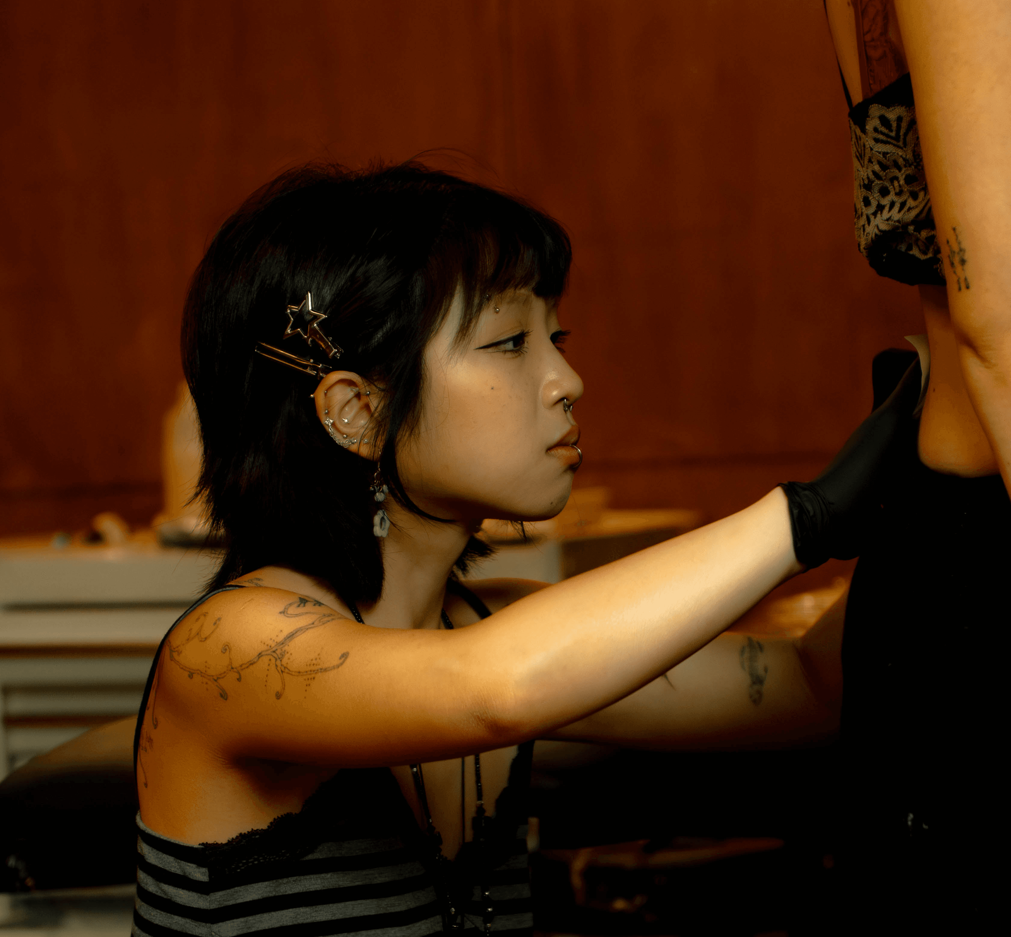 Studio 222 tattoo artist portrait with warm tones and detail