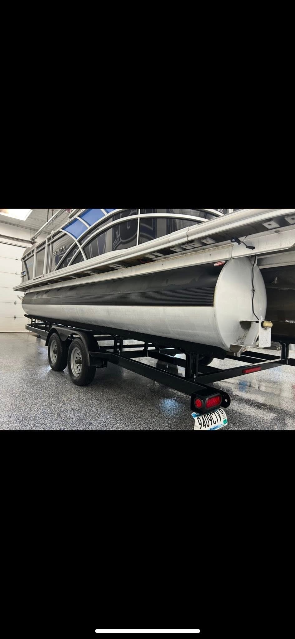 Pontoon boat detailed by RJ's Detailing in the garage
