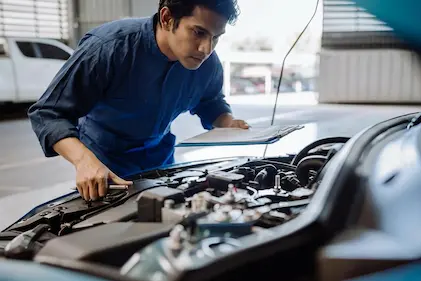 Young pro at Ideal checking on Hybrid car