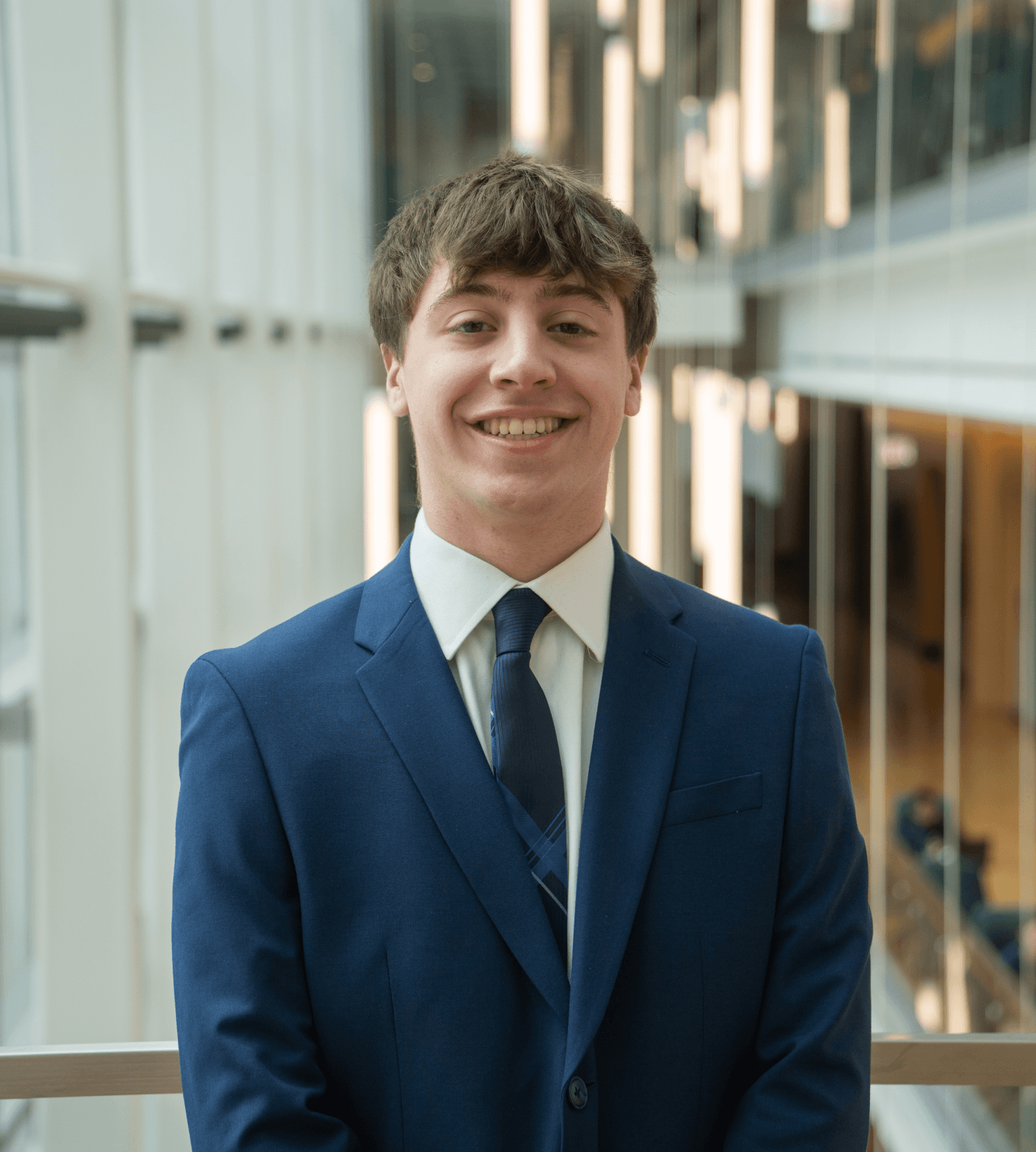 Headshot of Connor Nolan in a suit