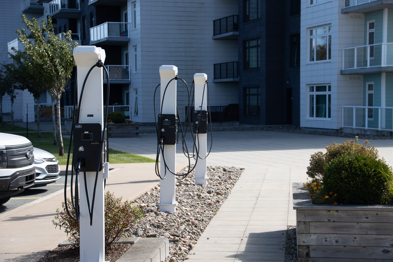 Electric Avenue pedestal mounted EV charging stations installed at multi-unit residential building for electric vehicle infrastructure in British Columbia