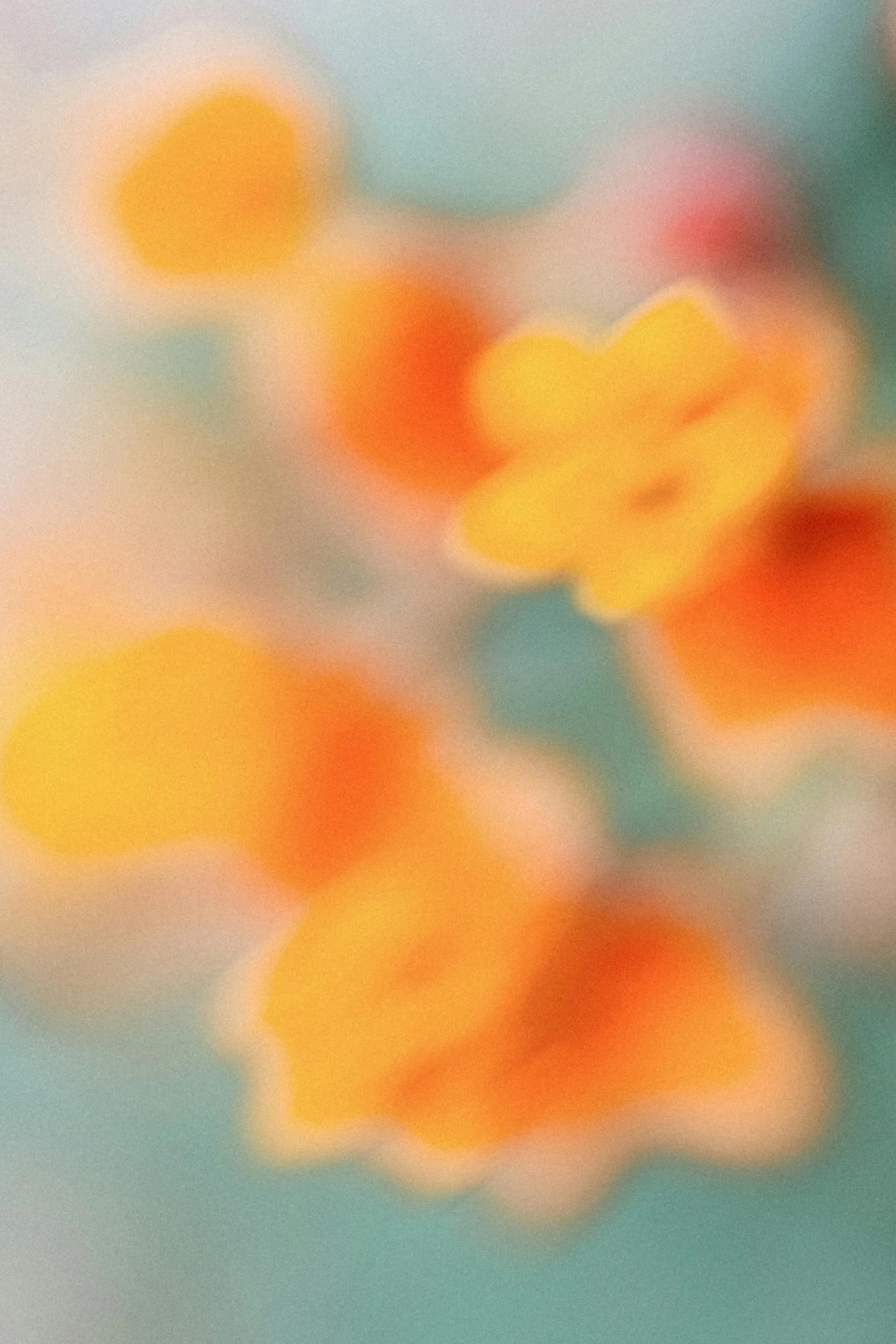 An abstract, out-of-focus view of bright orange and yellow flower shapes against a muted teal and pastel background.