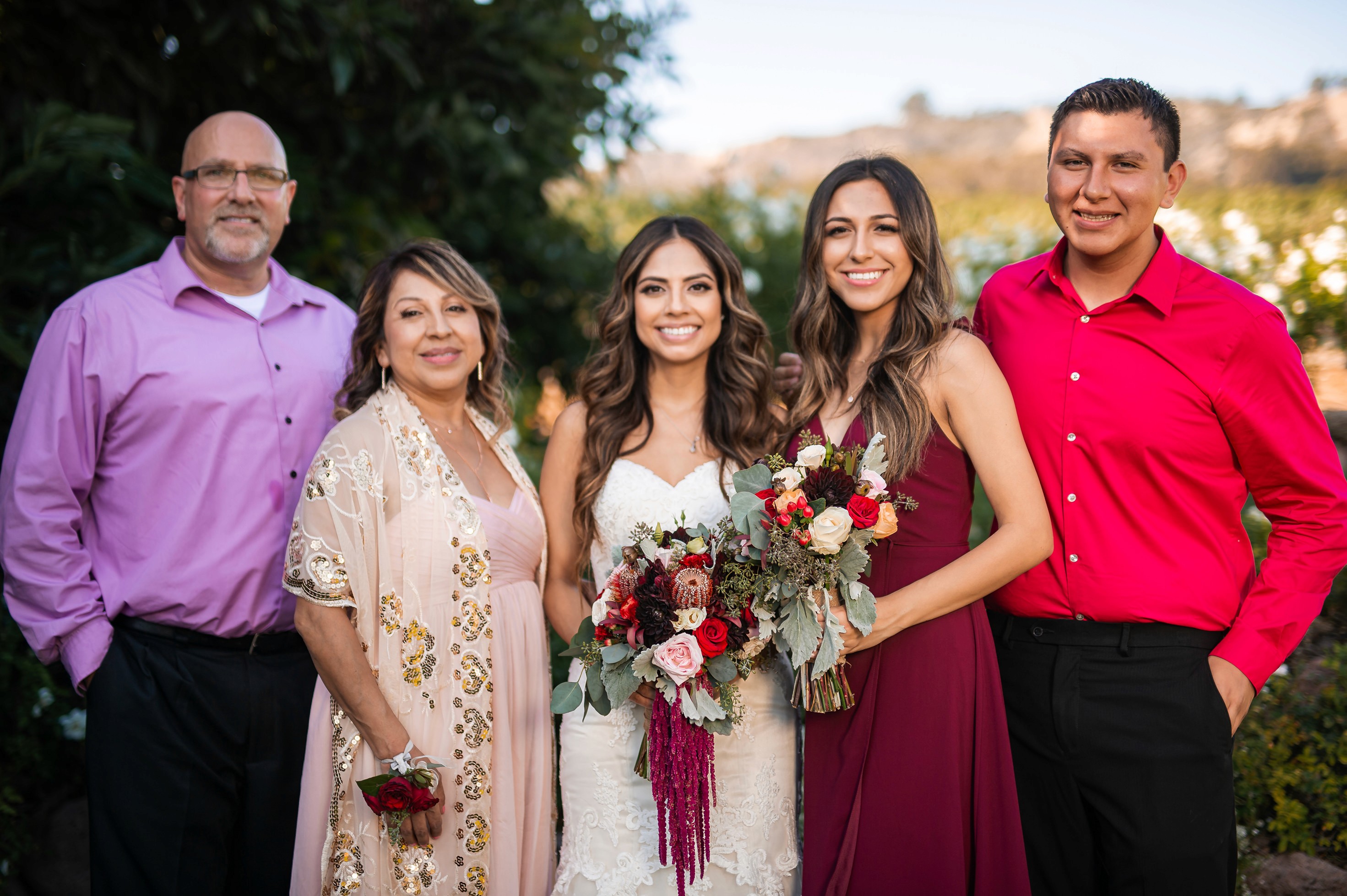 Flat lay wedding details with bouquet, rings, and sparkling bridal heels
