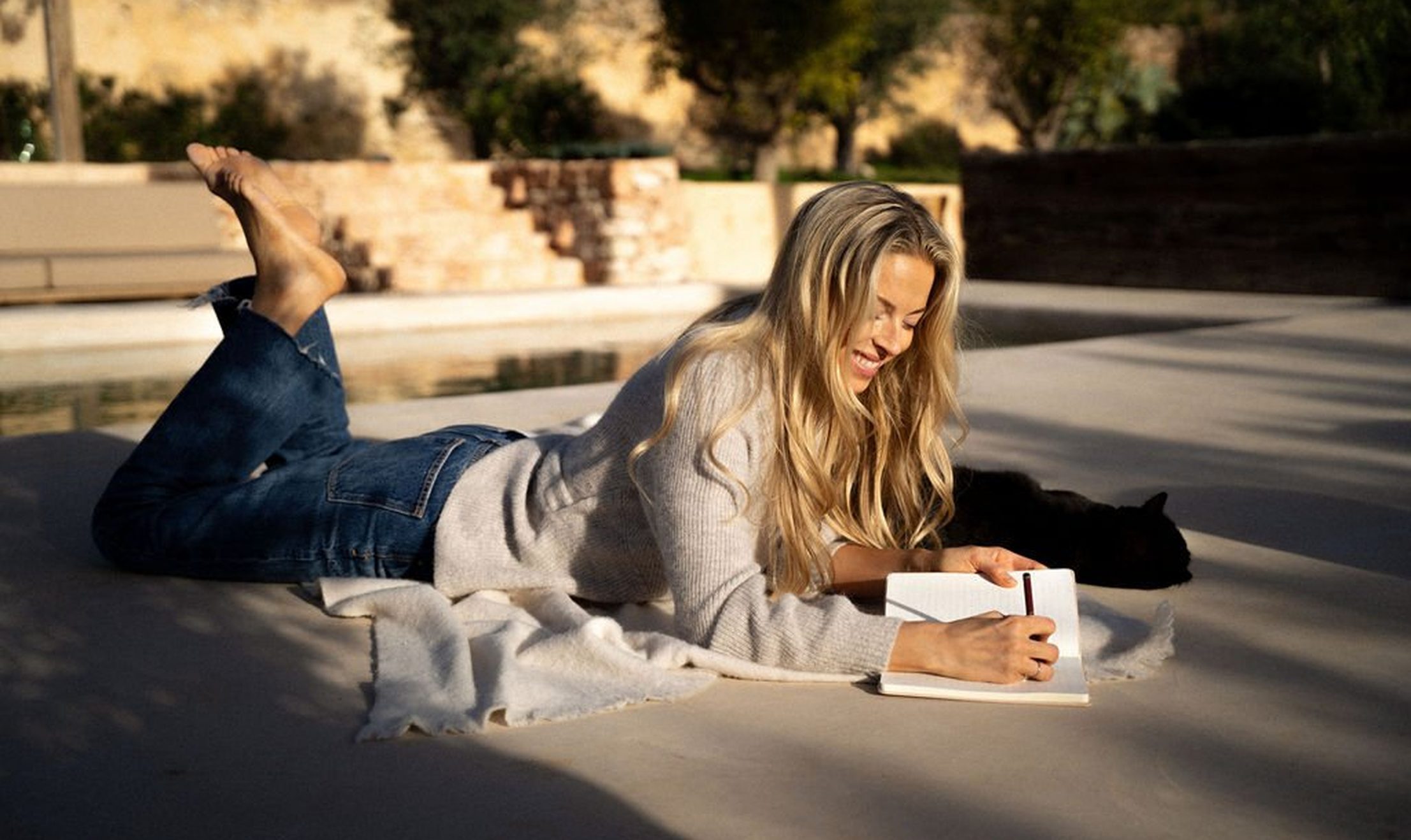 Woman relaxing outdoors in sunlight exploring menopause and sex drive changes