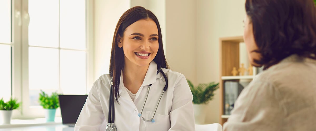 Doctor discussing urinary incontinence and pelvic organ prolapse treatment options with a patient.