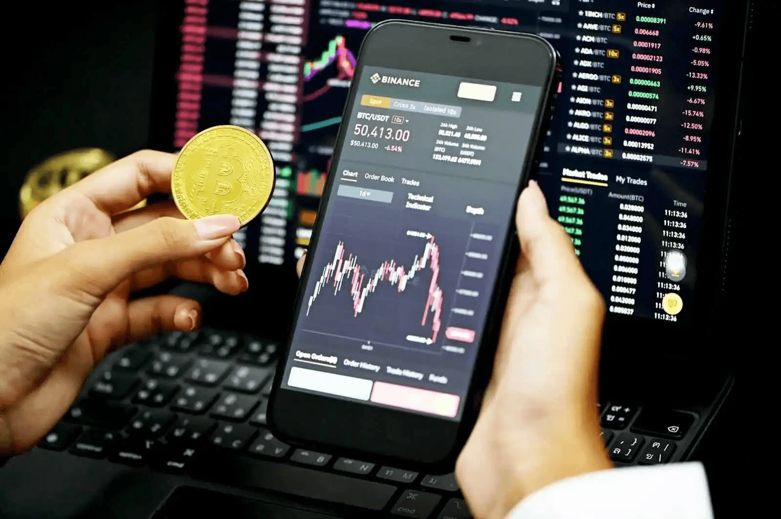Woman holding a bitcoin along with phone - Are Crypto Trading Bots Profitable