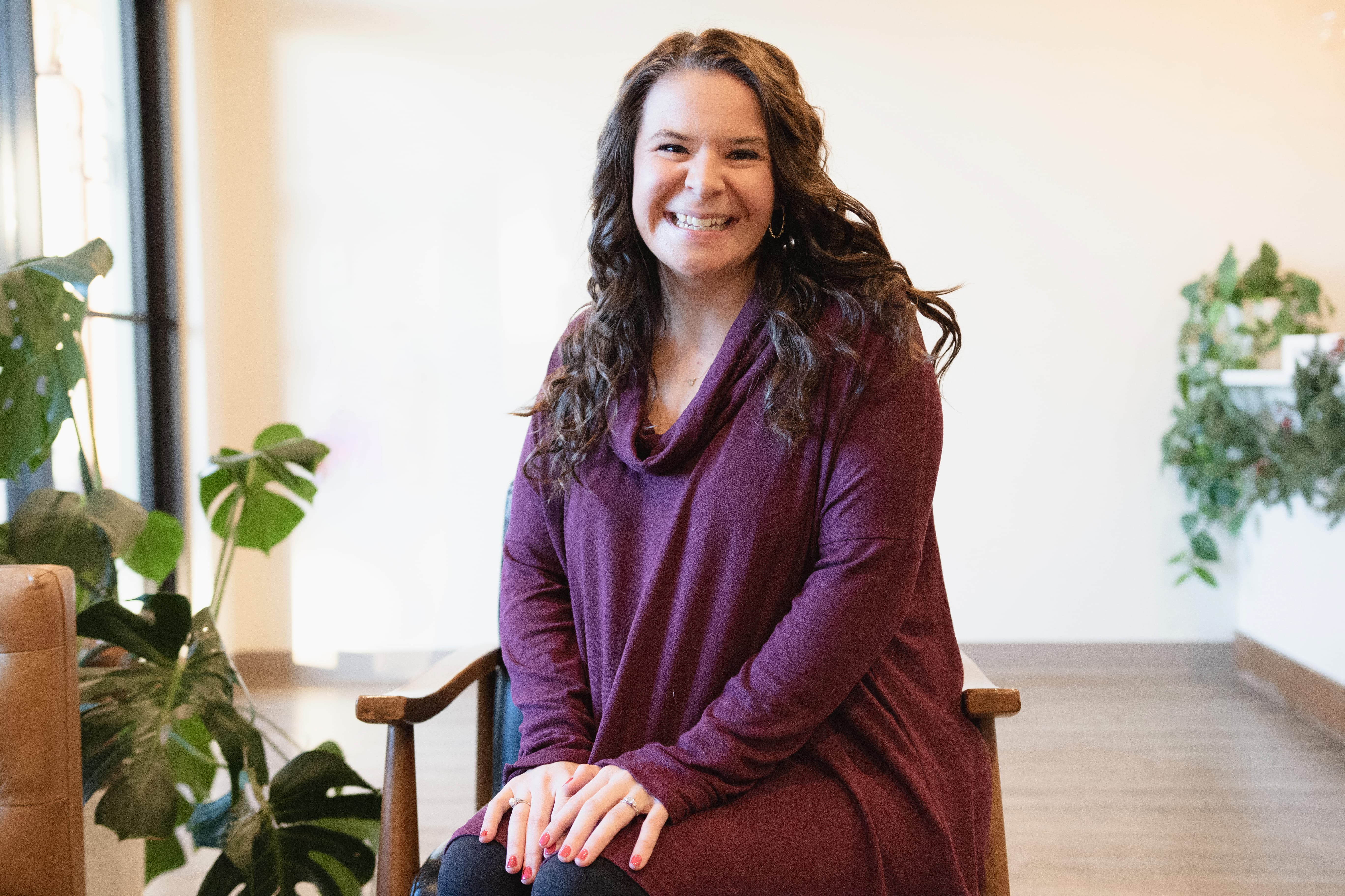 A headshot of a smiling female doctor.