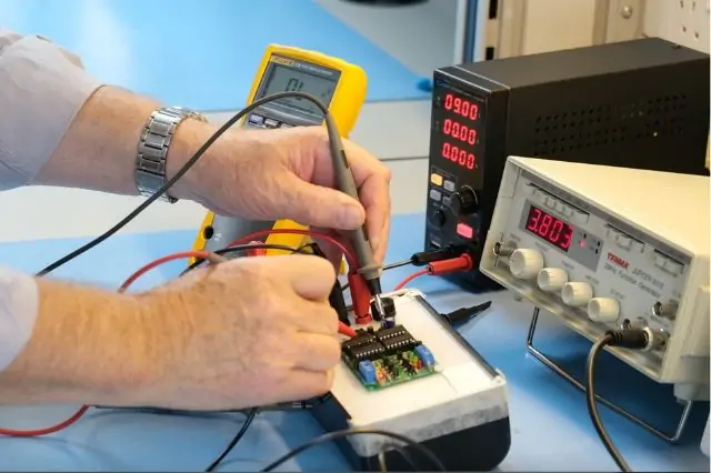 A technician troubleshooting an electrical panel.