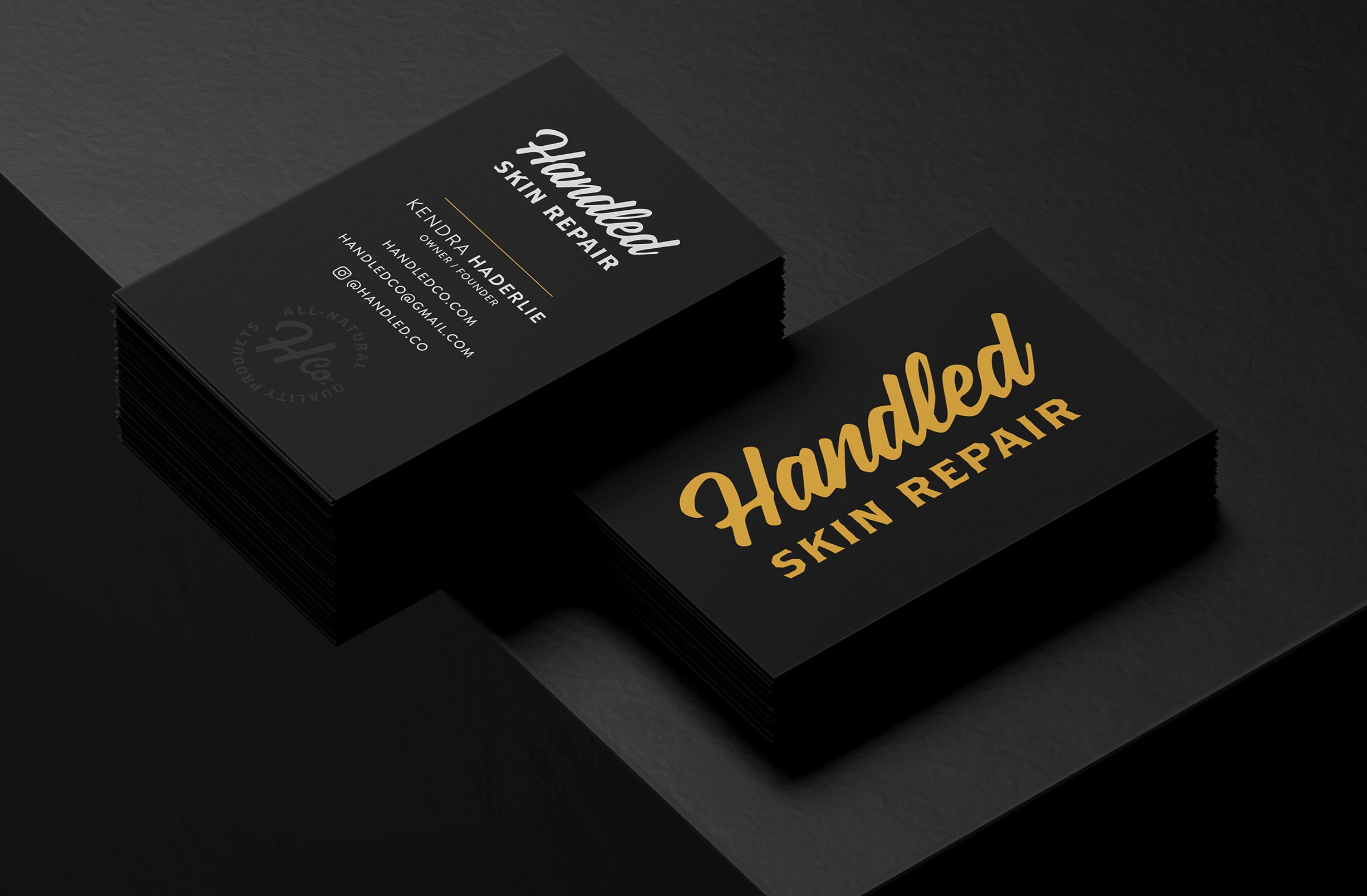 Handled Company business cards with gold foil logo