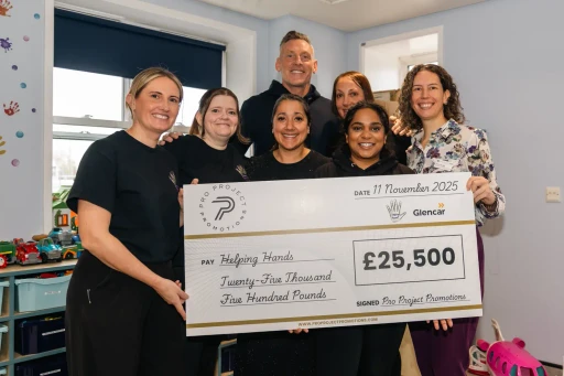 Helping Hands group photo with Graham and the cheque