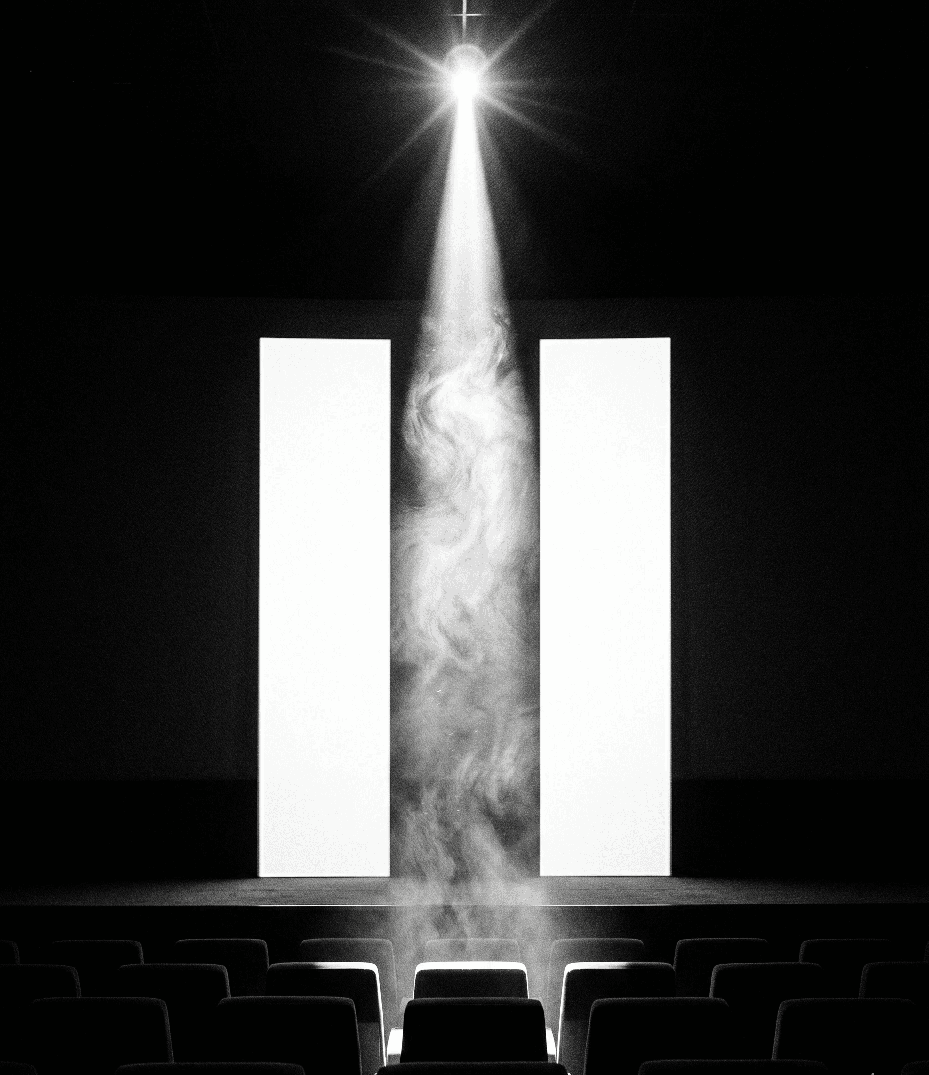 A dramatic, high-contrast black and white image of an empty movie theater. Two massive, glowing white vertical bars resembling a pause symbol stand prominently in the distance. A bright projector beam shines down from the top center, illuminating a thick, swirling column of dust and smoke directly between the two bars. The foreground features the dark silhouettes of empty theater rows