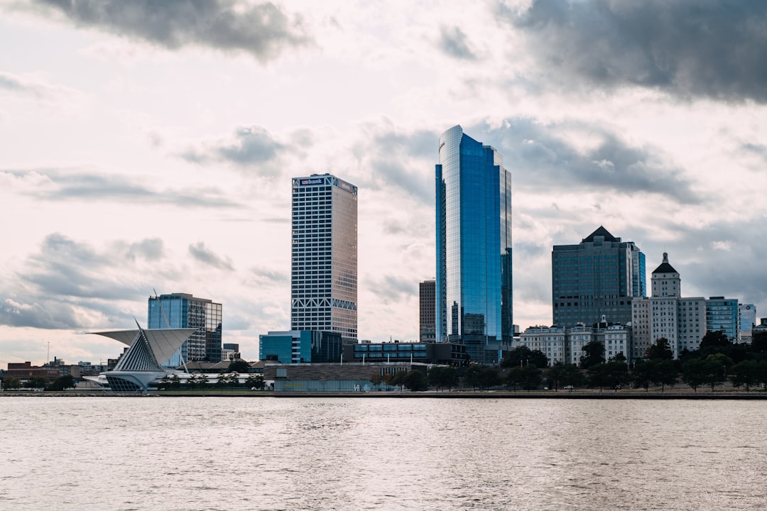 Milwaukee waterfront skyline with a distinctive museum wing and tall blue tower.