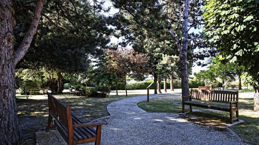 Contemporary residence complex with modern architecture outdoor seating areas and garden landscaping