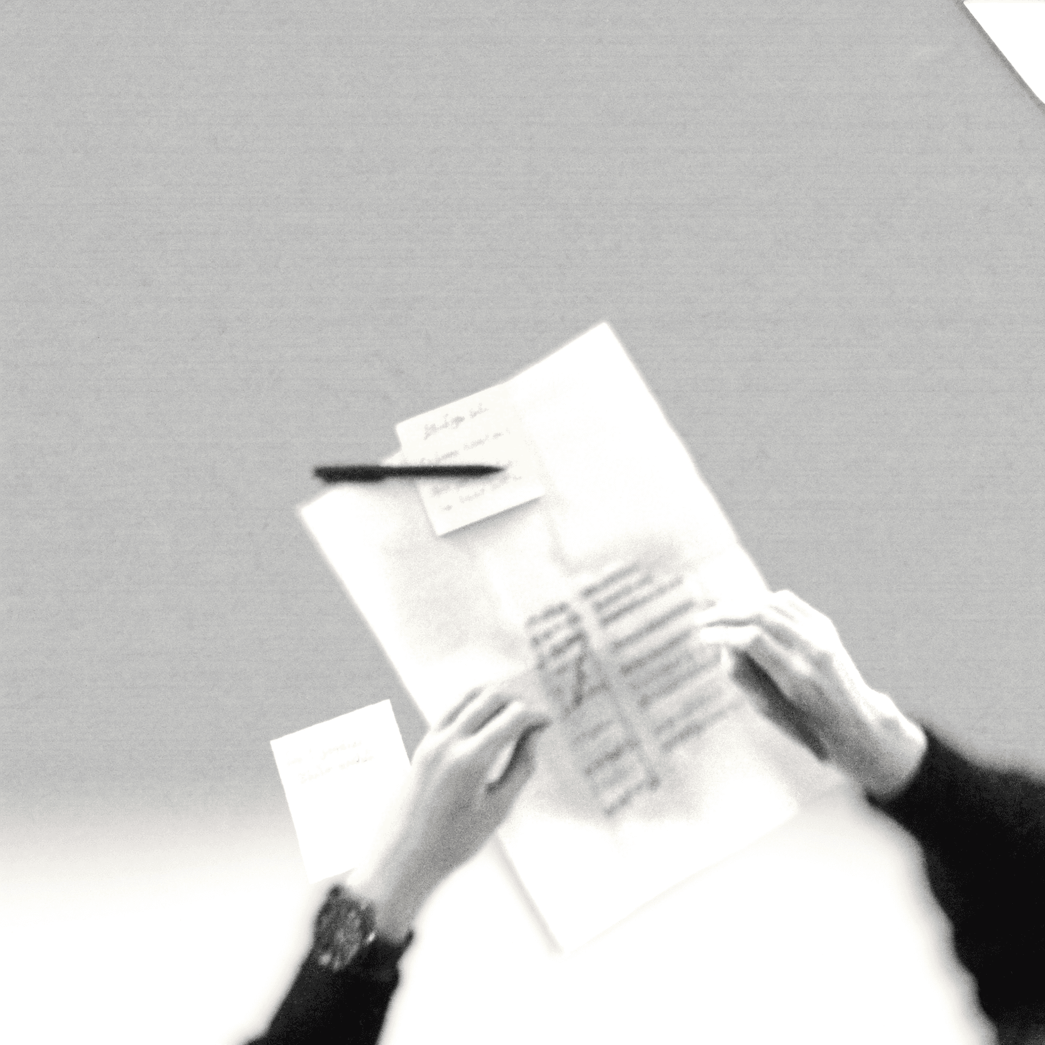 Documents and planning materials on a desk, representing customized solutions tailored to client needs.