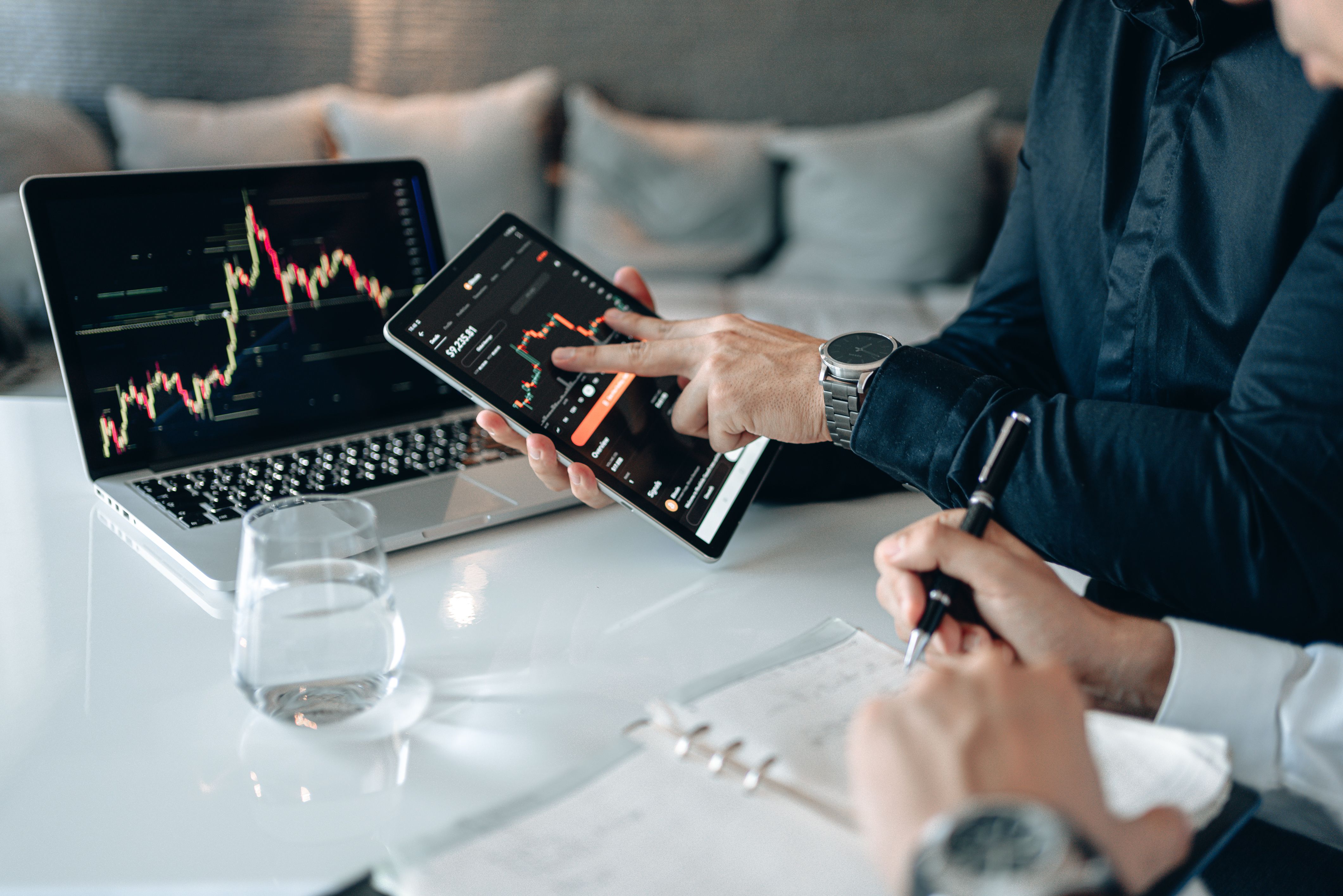 professionals-analyzing-financial-data-on-a-tablet-and-laptop-in-an-office-setti - alphatradezone (pexels)