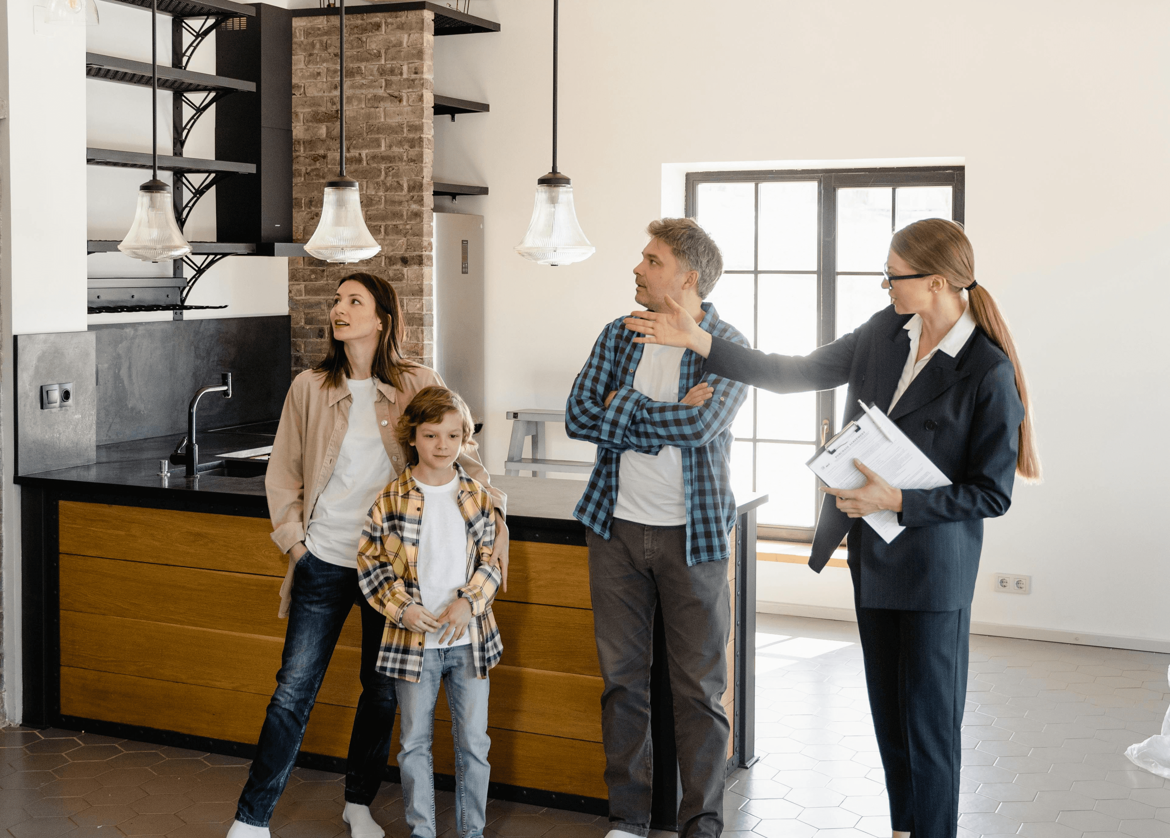 Family being shown around by a real estate agent