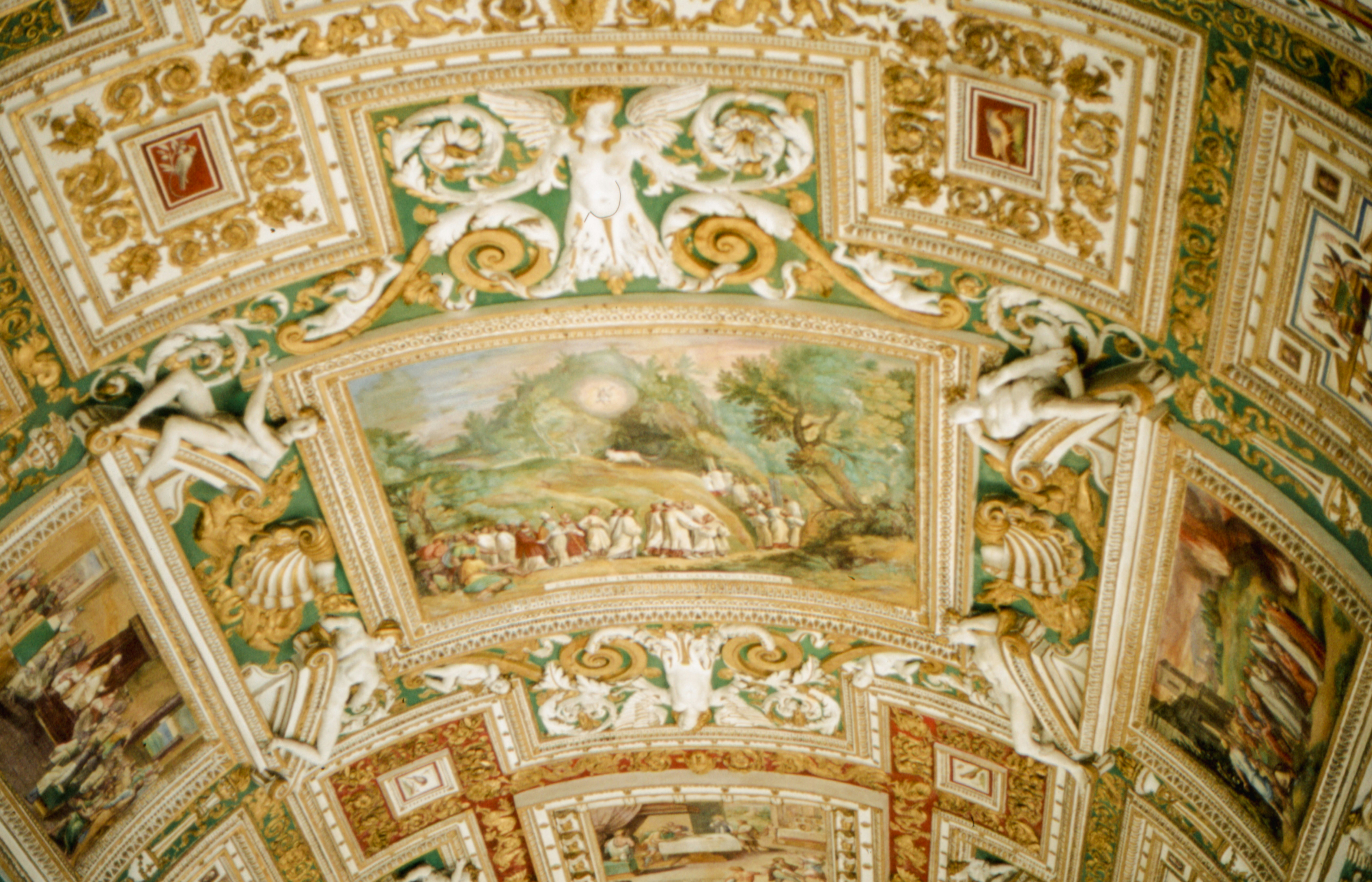 the ceiling of a building with paintings on it