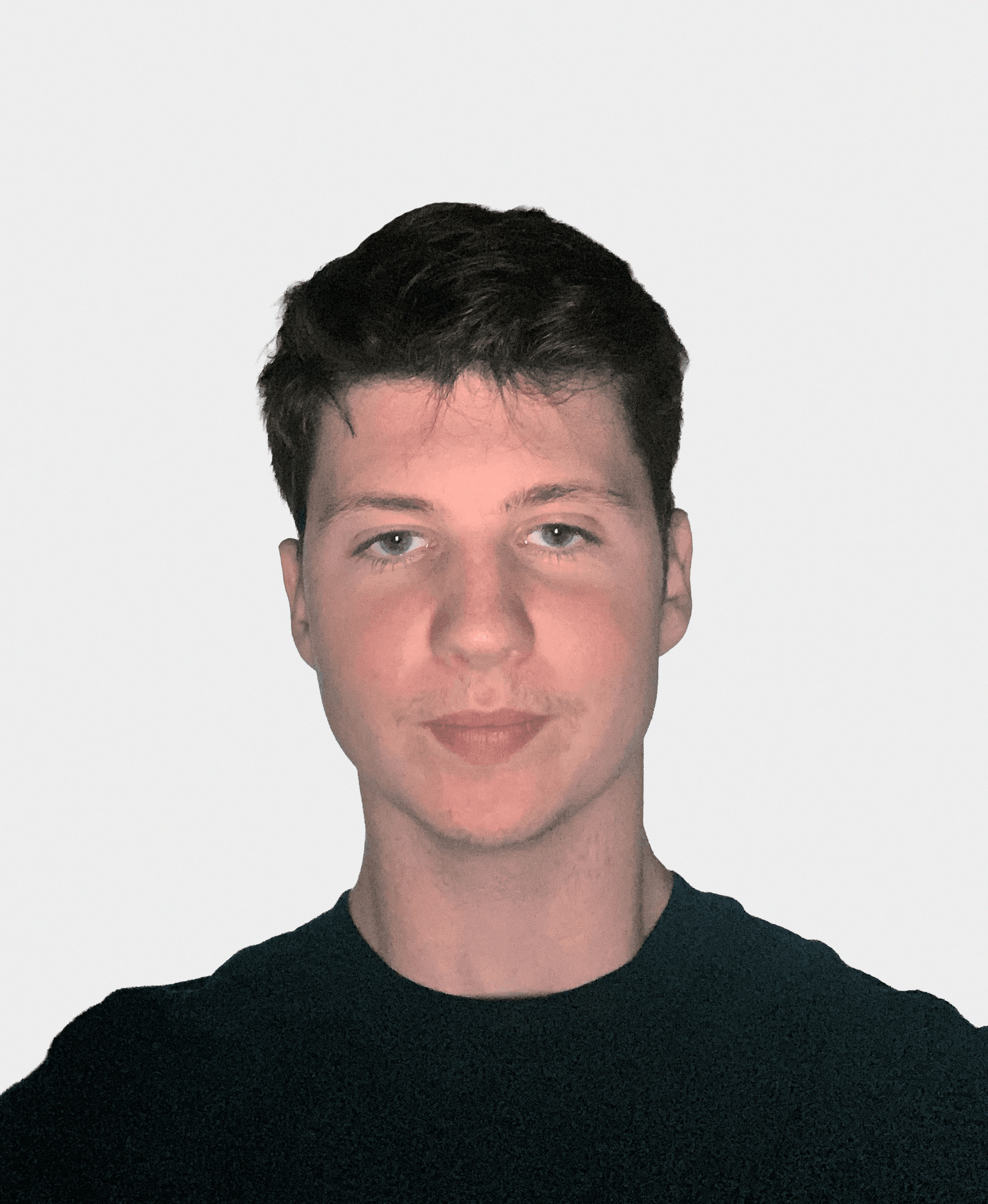 A person in a winter coat and furry hat walking along a snow-covered path through a forest of frosted trees.