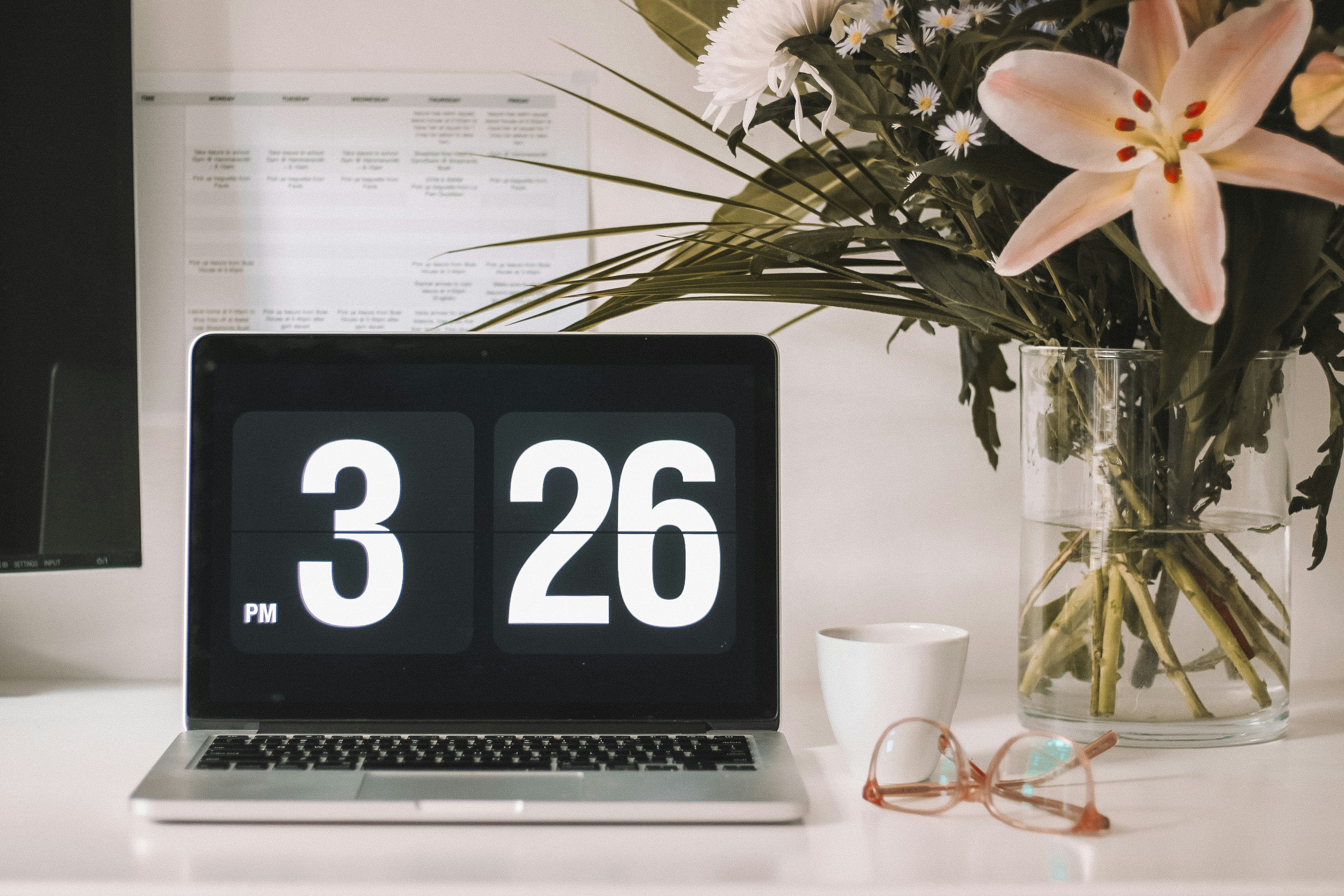 A laptop is open displaying the time 3:26pm.