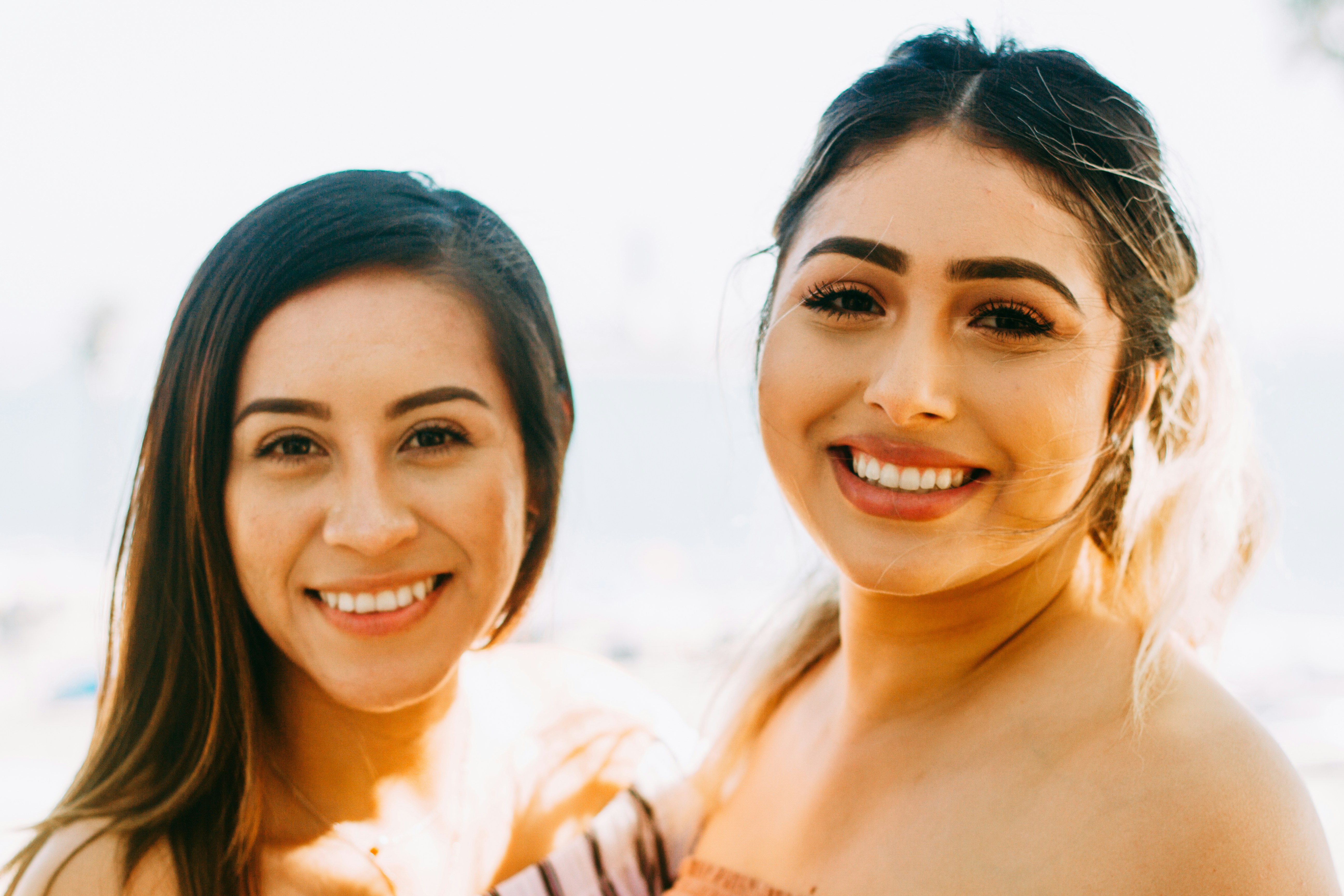 woman enjoying a wedding - Best Colors for Olive Skin