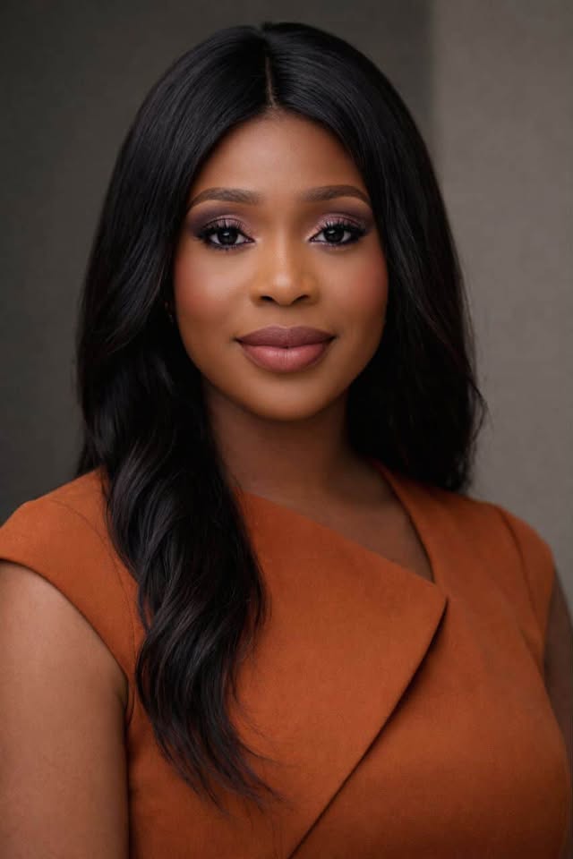 smiling woman sitting on grass during daytime