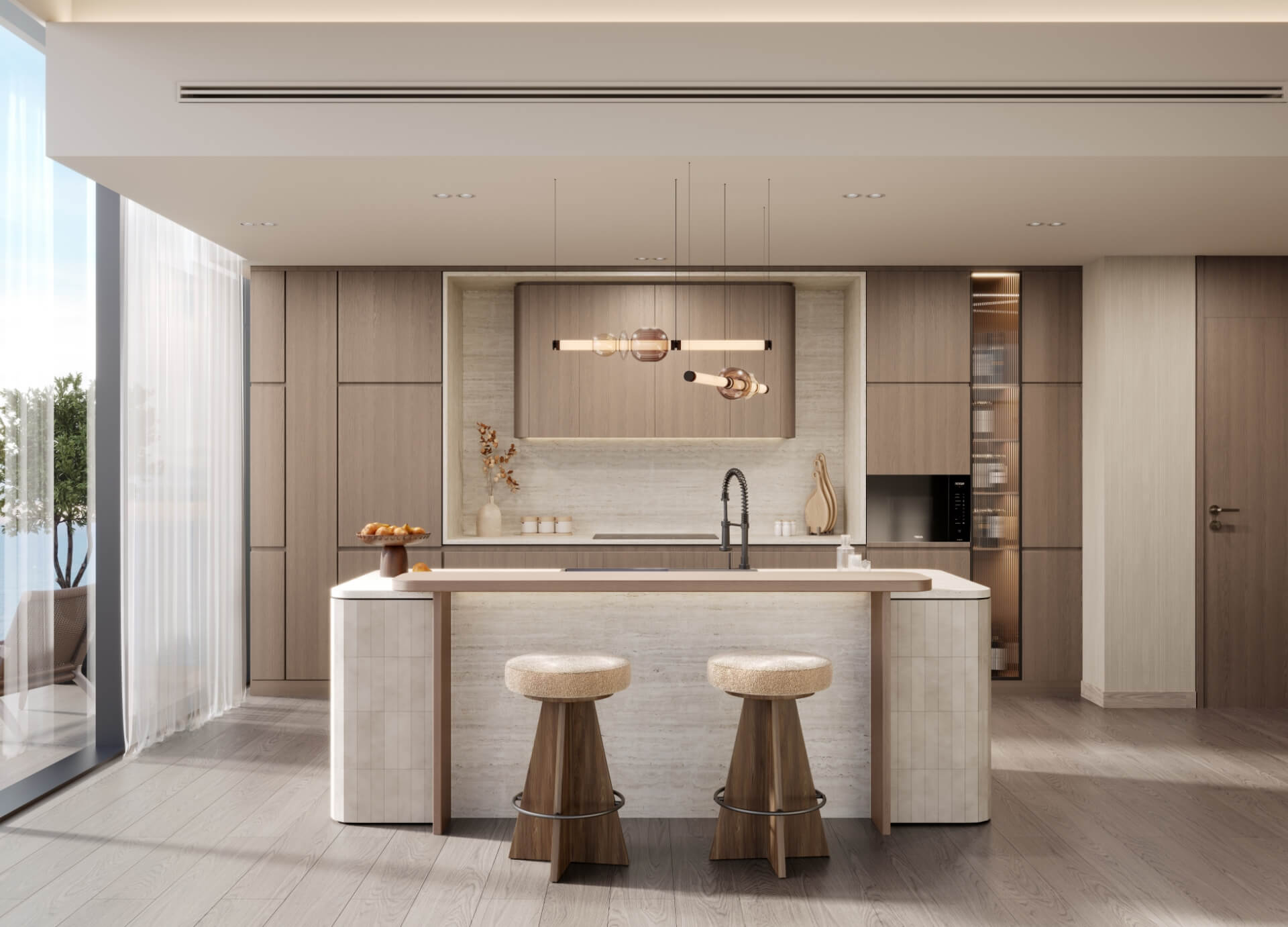 A modern kitchen featuring a large island with bar stools, showcasing a sleek and functional design.