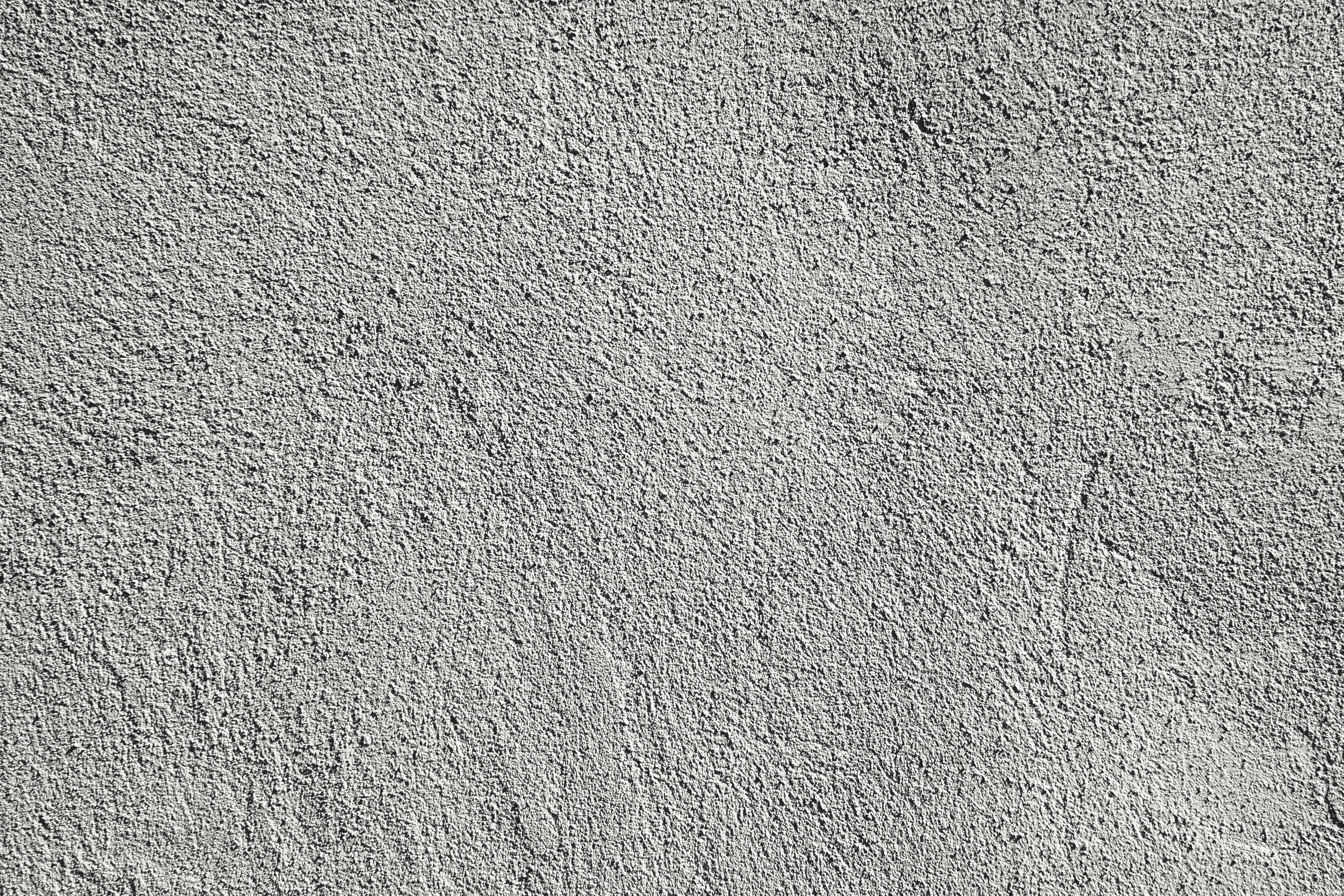 Raw tactile concrete wall texture with fine architectural relief