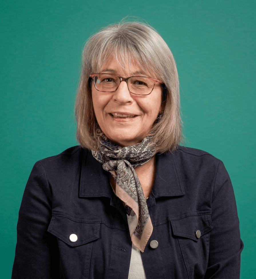 selective focus photography of woman with brown wooden wall background