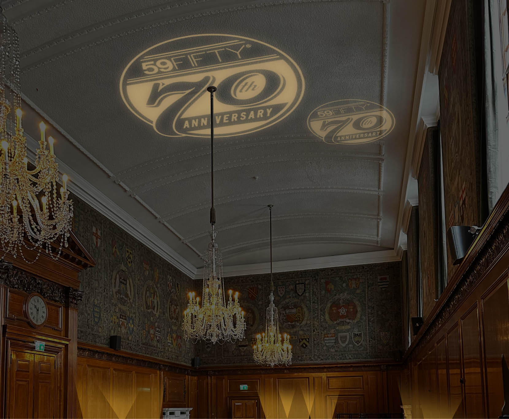render of event interior featuring dramatic lighting, heritage graphics and exhibition-style displays