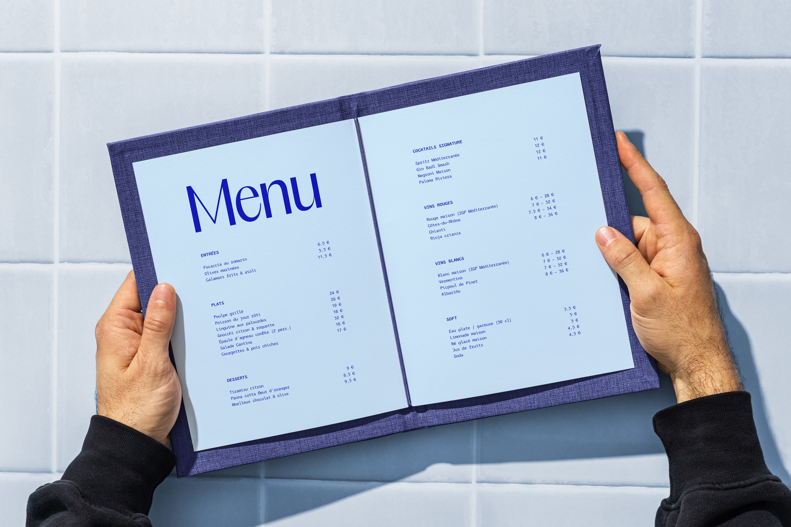 Minimalist coffee can design in hand – black and white packaging with bold typography