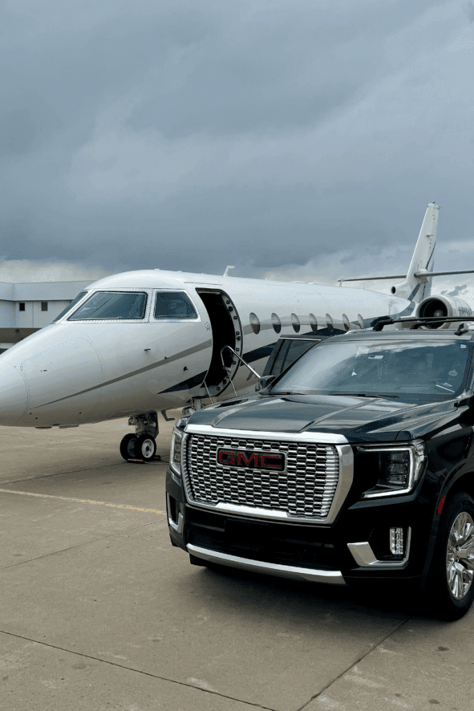 Private jet and a GMC SUV parked on a tarmac under overcast skies, symbolizing the convergence of luxury travel and commitment to sustainability in modern transportation.