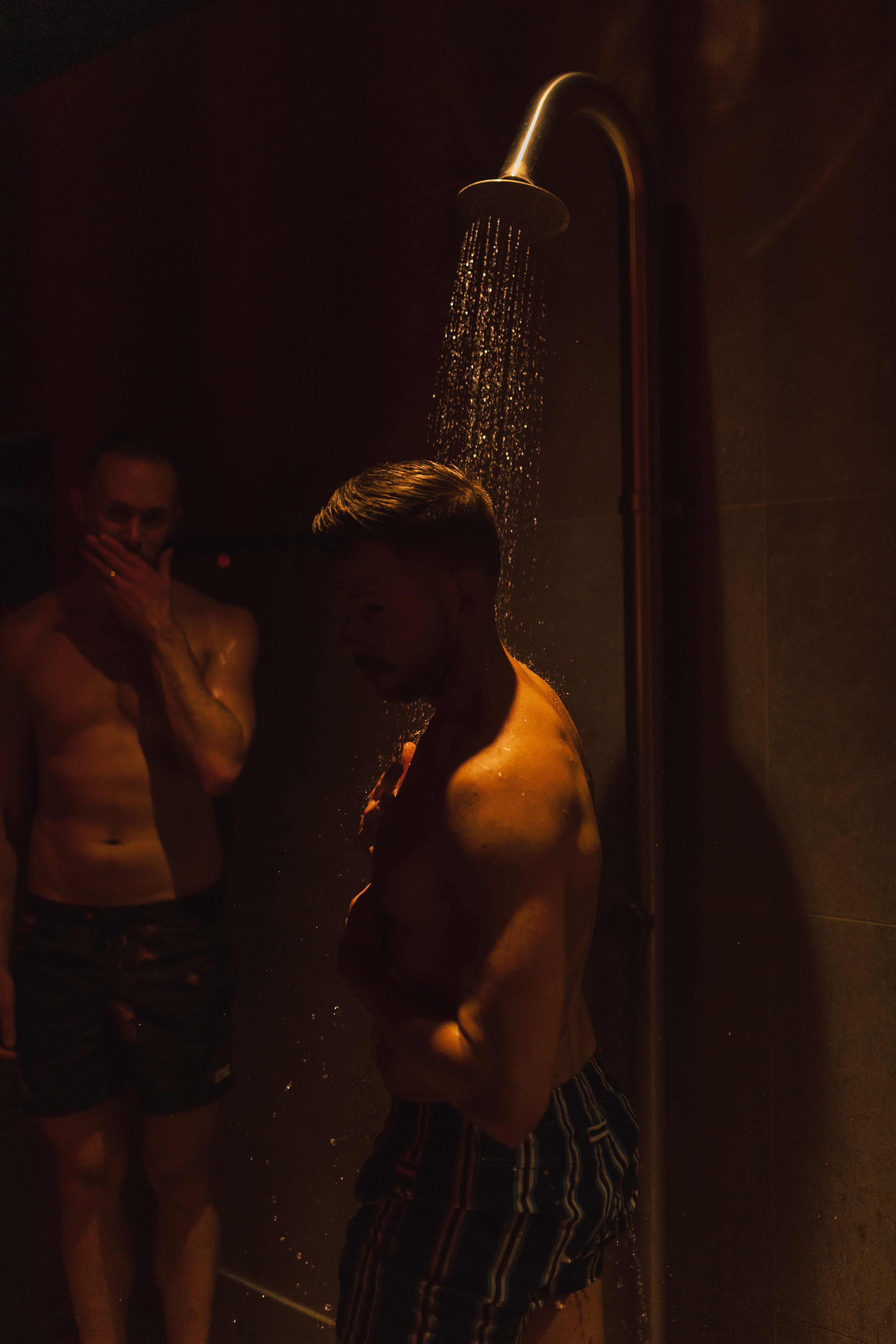 A beautiful young woman smiling at the camera on a mountain field