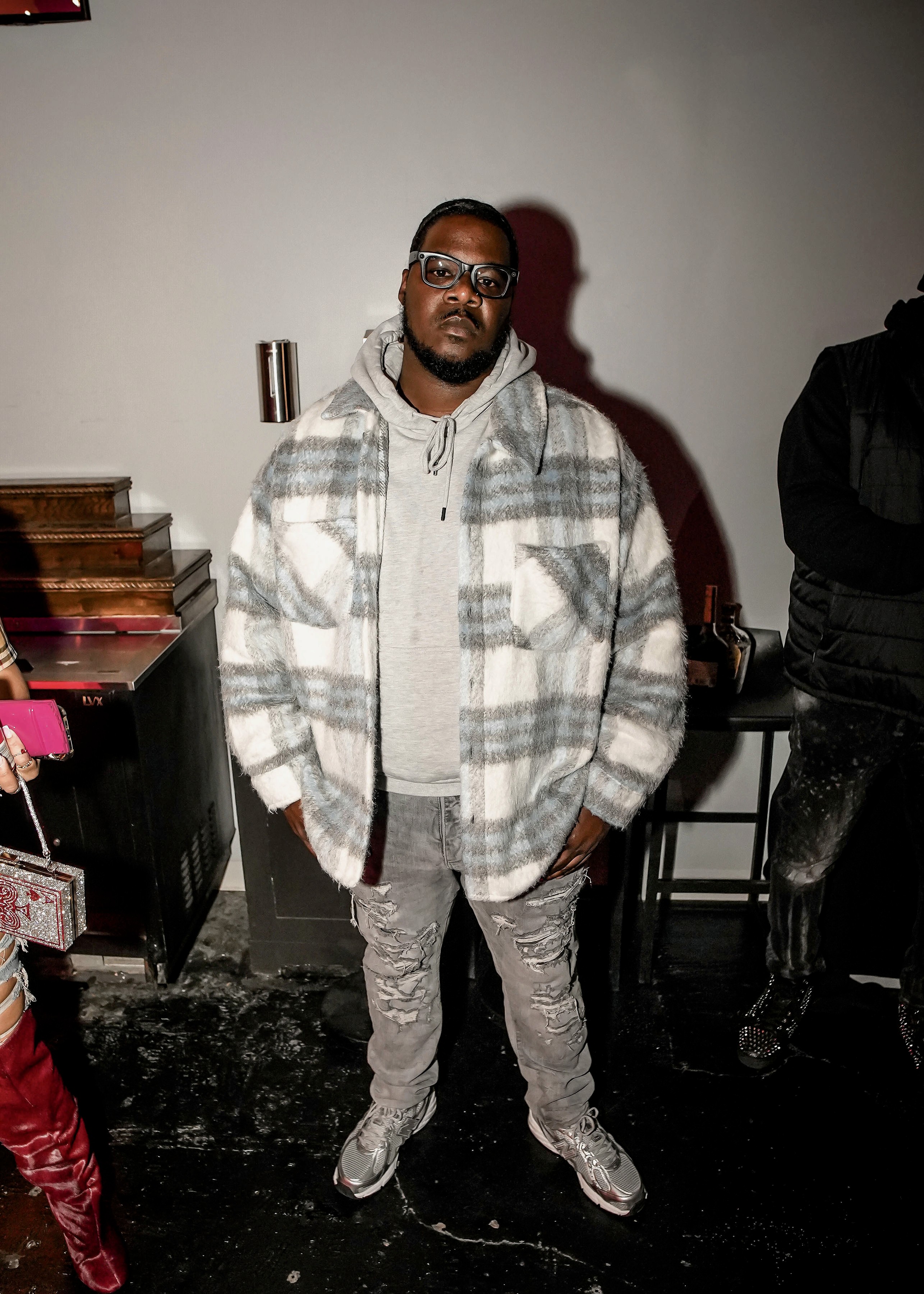 model wearing a sweatshirt in a green background