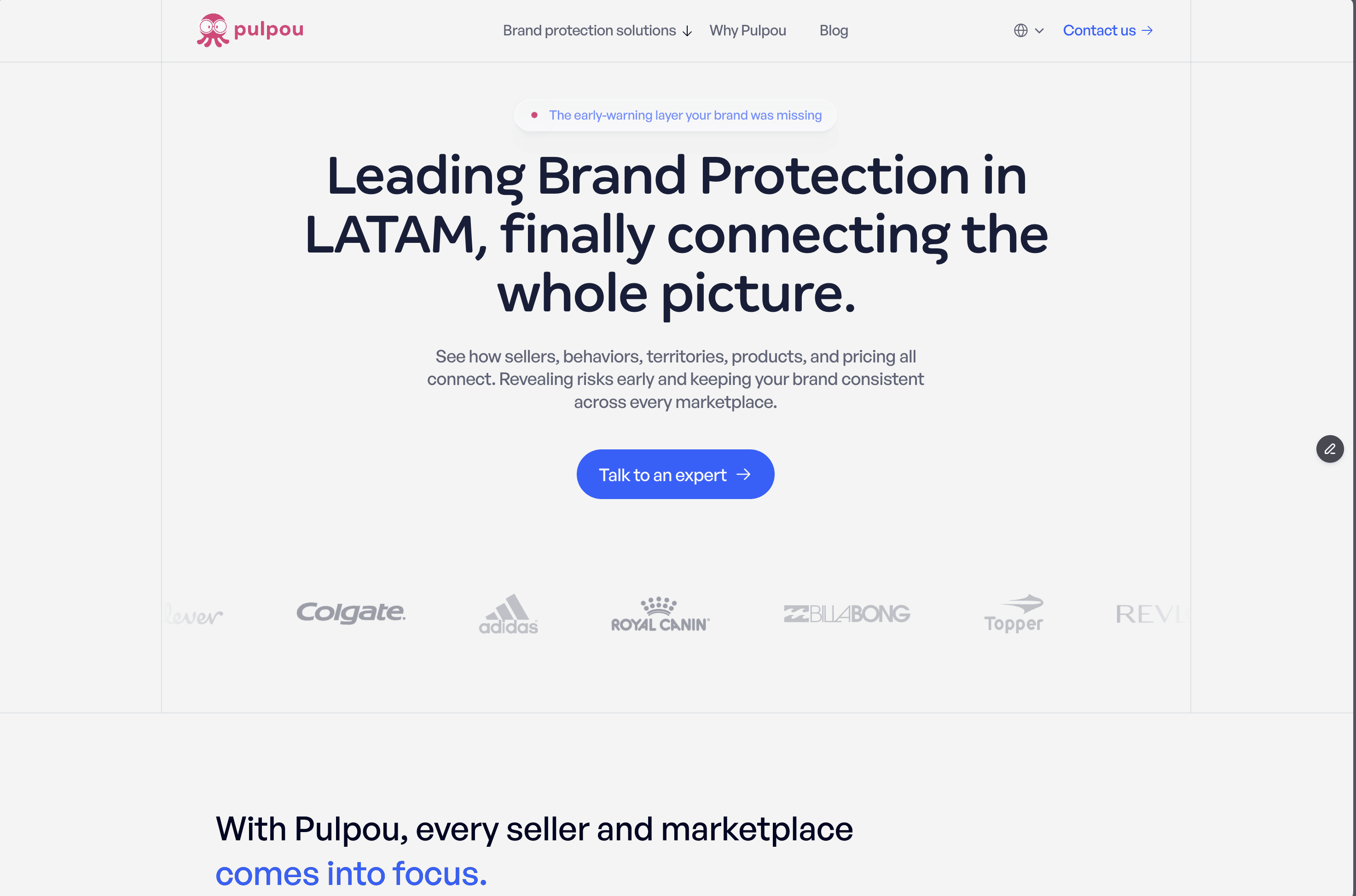 People on concrete structure by the ocean at sunset