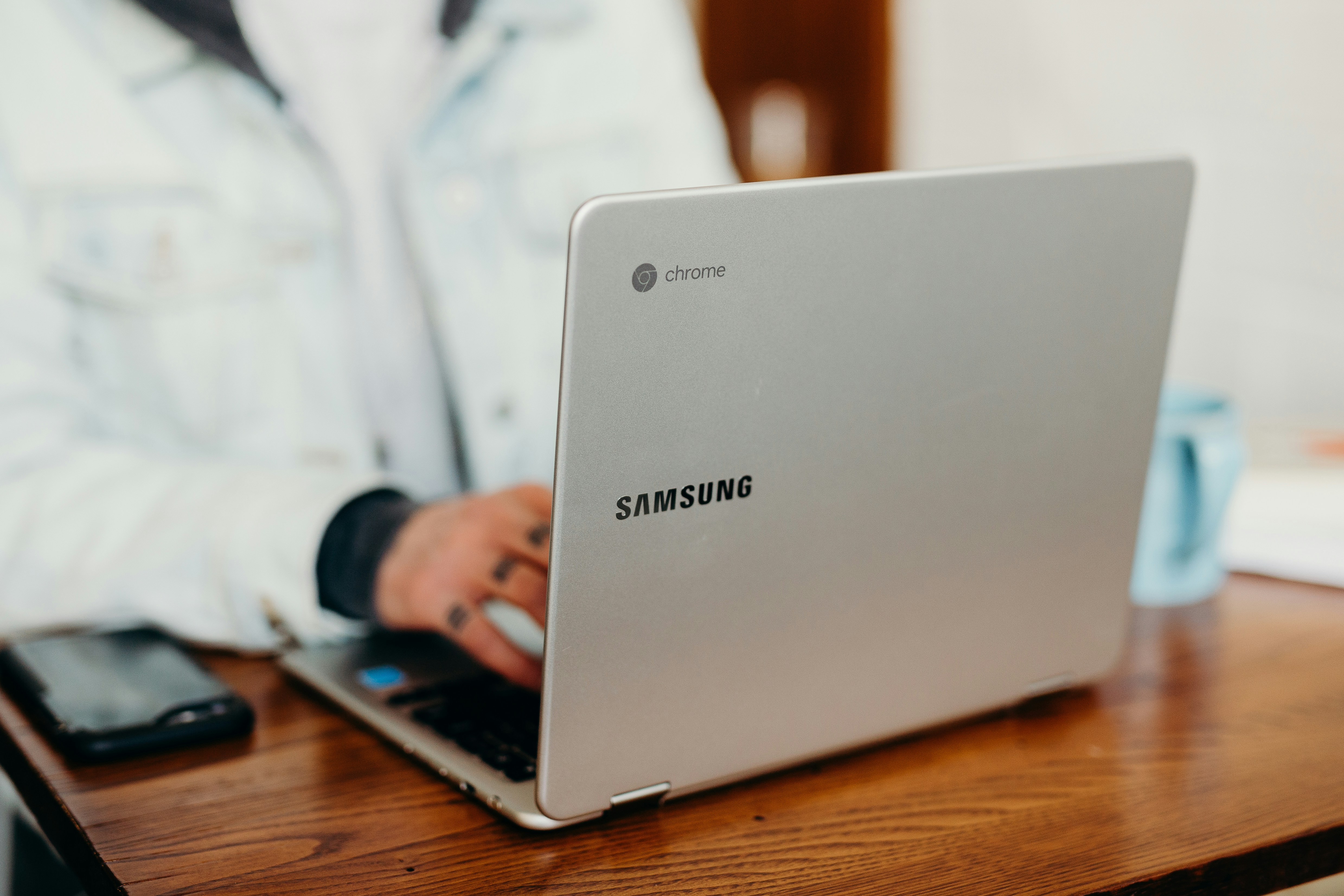 woman with laptop in hand - Using AI in the Workplace 